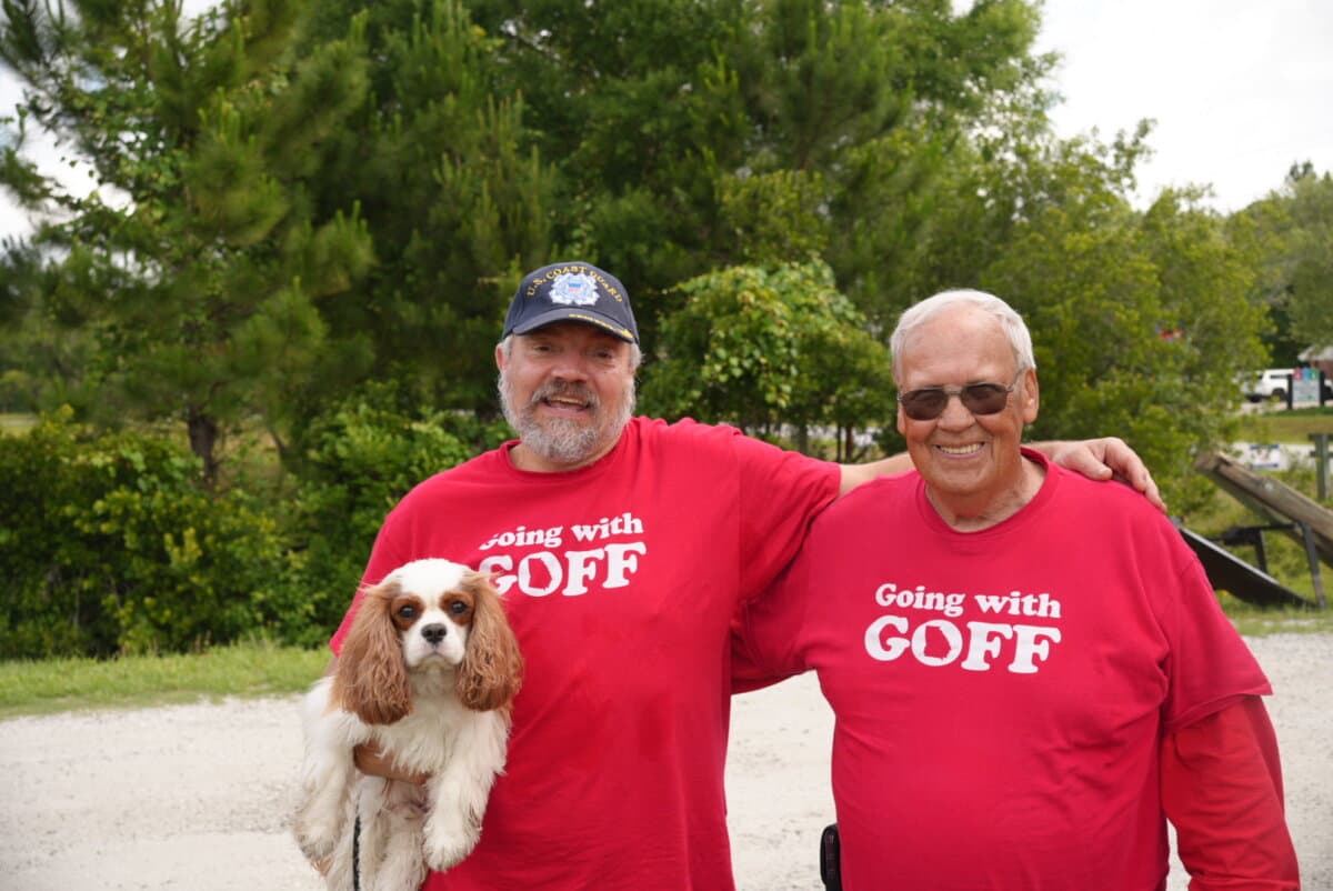 Joe Kaminski (left) is holding his dog Kirby alongside Clayton Ben Goff, who is running to be a county commissioner in Camden County, Georgia. The pair were outside a polling location on primary election day in St. Marys, Georgia, on May 19. (Troy Myers/Epoch Times)