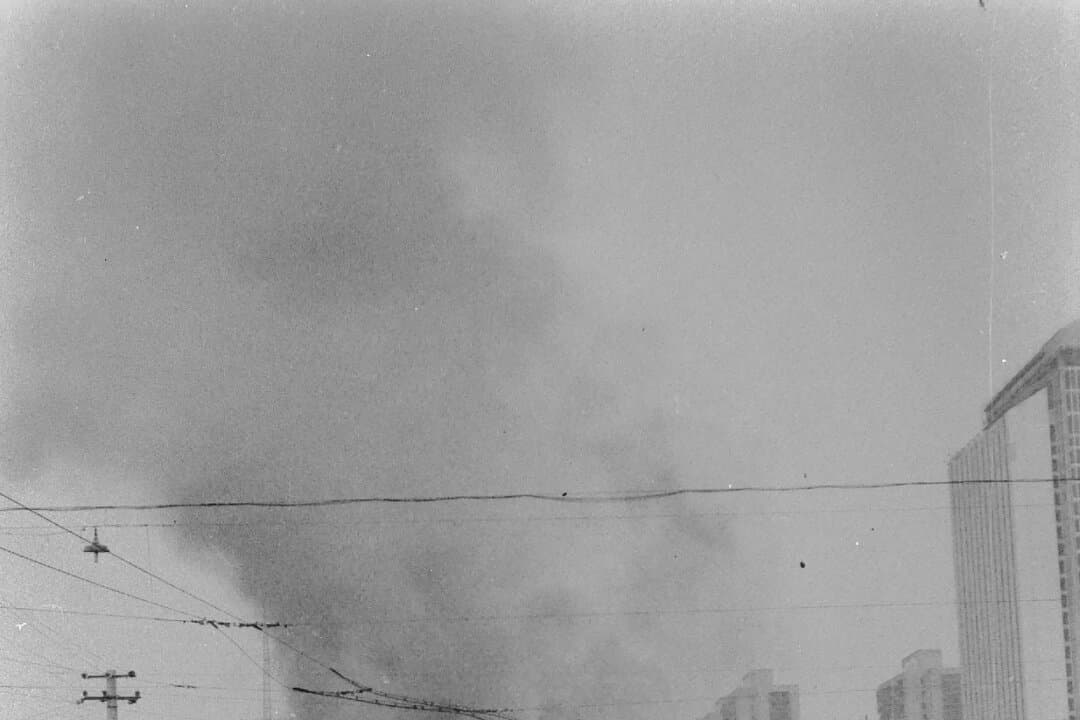 Burned vehicles, toppled barricades, and bloodstains on the ground during and after the suppression of the pro-democracy Tiananmen Square protests in Beijing in June 1989. (Provided to The Epoch Times)