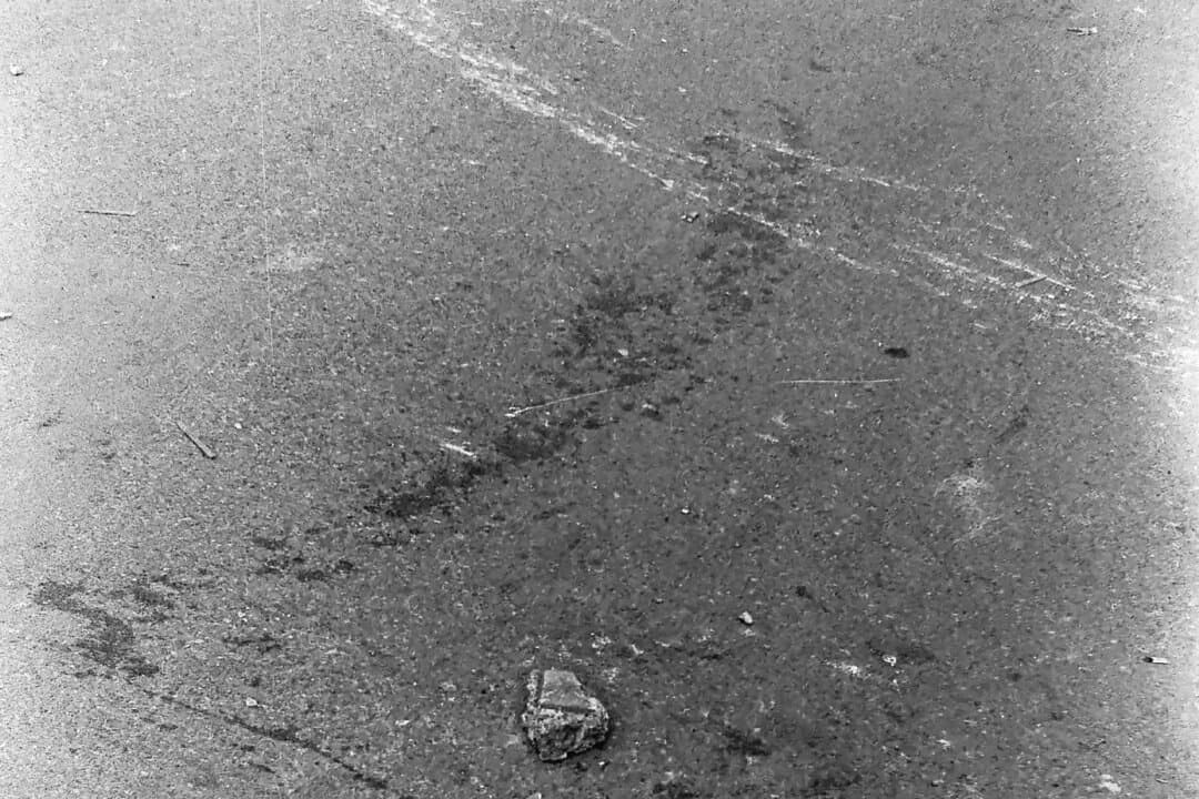 Burned vehicles, toppled barricades, and bloodstains on the ground during and after the suppression of the pro-democracy Tiananmen Square protests in Beijing in June 1989. (Provided to The Epoch Times)