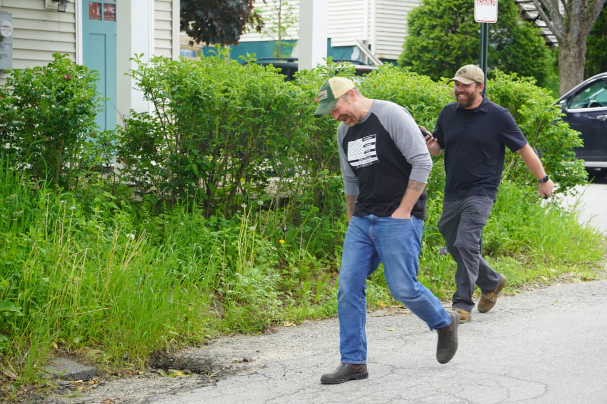 Graham Platner and a staffer leave a campaign event in Belfast, Maine, on June 6, 2026, just days ahead of the state's June 9 primary. The boutique oysterman and U.S. Marine Corps veteran hopes to oust Sen. Susan Collins (R-Maine) in November. (Nathan Worcester/The Epoch Times)