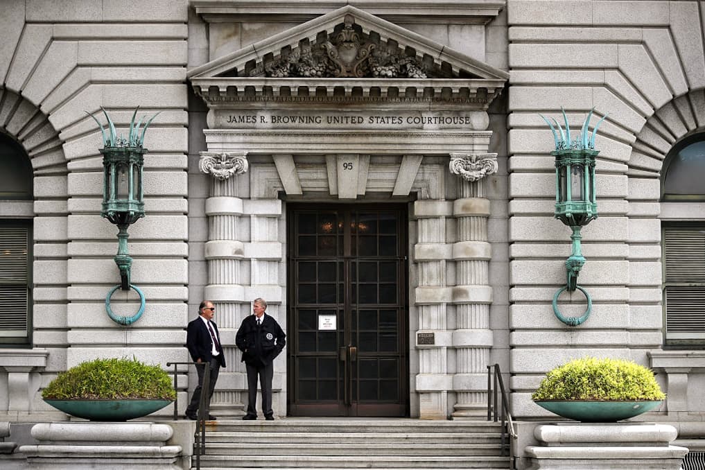 Security guards stand in front of the Ninth U.S. Circuit Court of Appeals in San Francisco on June 12, 2017. Several appeals courts have issued conflicting interpretations of the Illegal Immigration and Immigrant Responsibility Act. (Justin Sullivan/Getty Images)