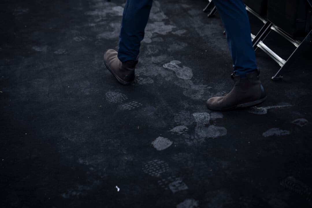 Shoe prints appear after members of the press walk through the UFC setup ahead of the UFC Freedom Fight on June 14, on the South Lawn of the White House on June 11, 2026. (Madalina Kilroy/The Epoch Times)
