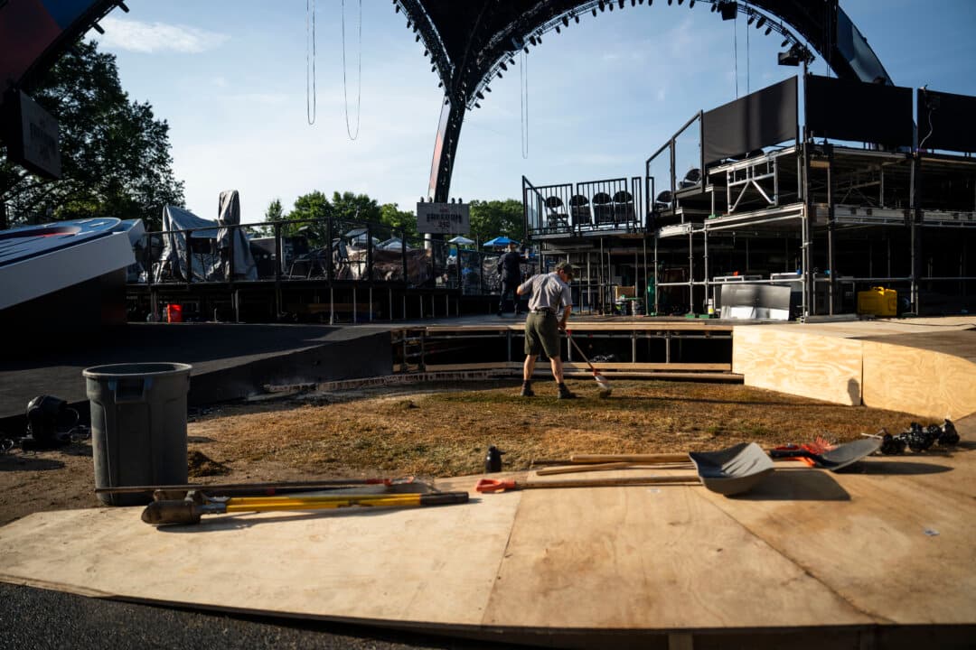A worker tends the lawn near the UFC arena at the White House on June 11, 2026. (Madalina Kilroy/The Epoch Times)