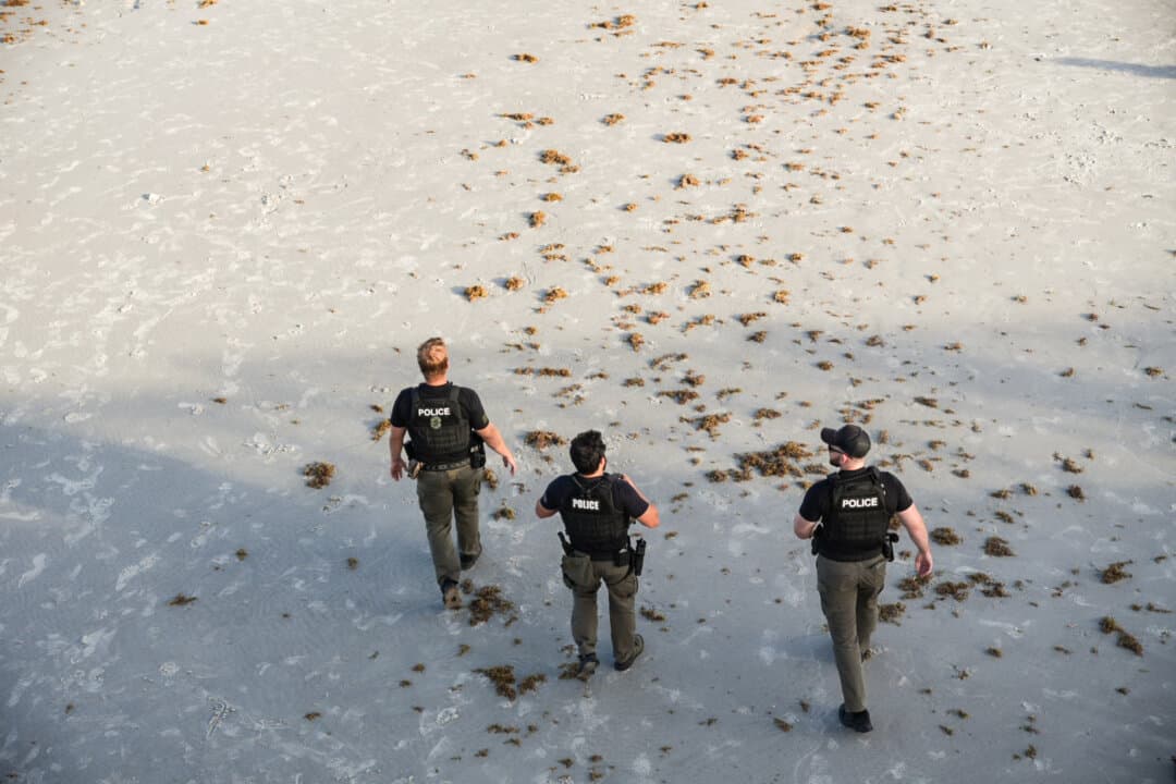 (Top) Several police officers are seen looking after a mild takeover in Jacksonville Beach, Fla., on June 6, 2026. (Bottom) Police officers patrol the beach for a planned takeover in Jacksonville Beach, Fla., on June 6, 2026. (Troy Myers/The Epoch Times)