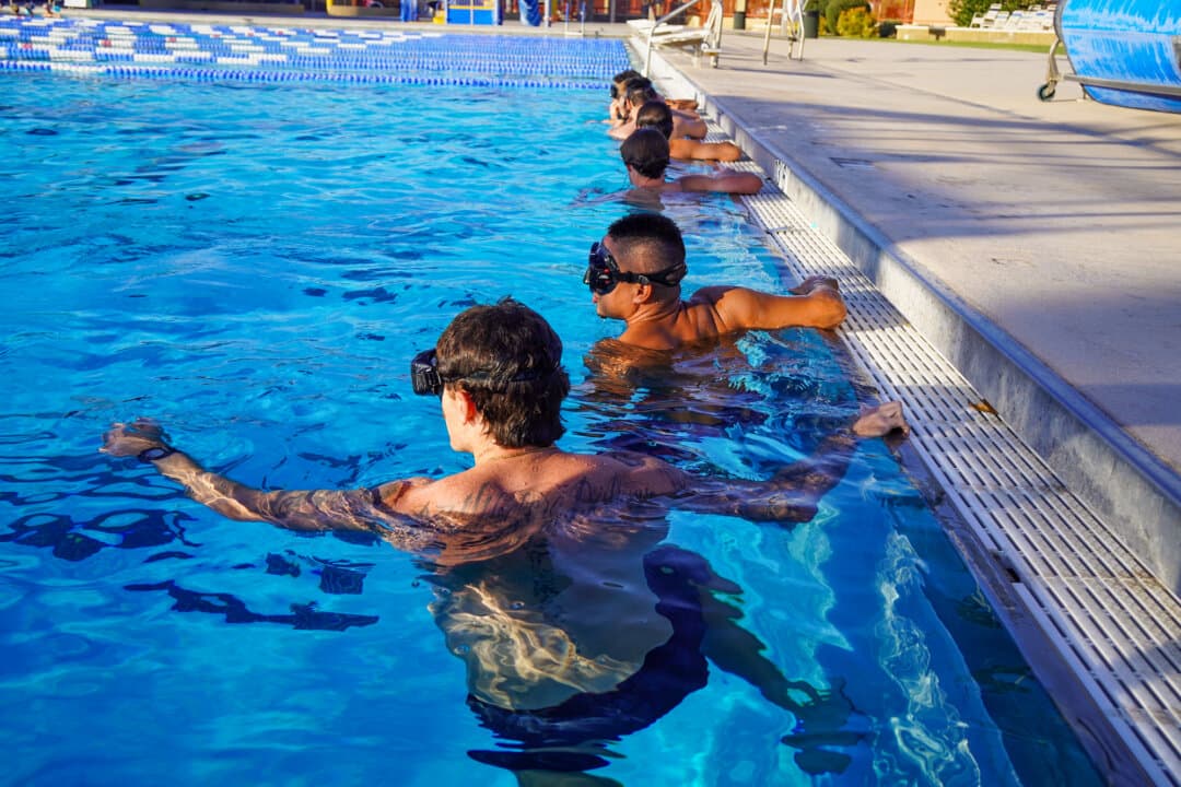 Deep End Fitness trainees prepare for another endurance swim, in Scottsdale, Ariz., on May 21, 2026. The center has become a destination for athletes, military-bound young adults, and aspiring first responders looking for an edge before entering demanding training pipelines. (Allan Stein/The Epoch Times)