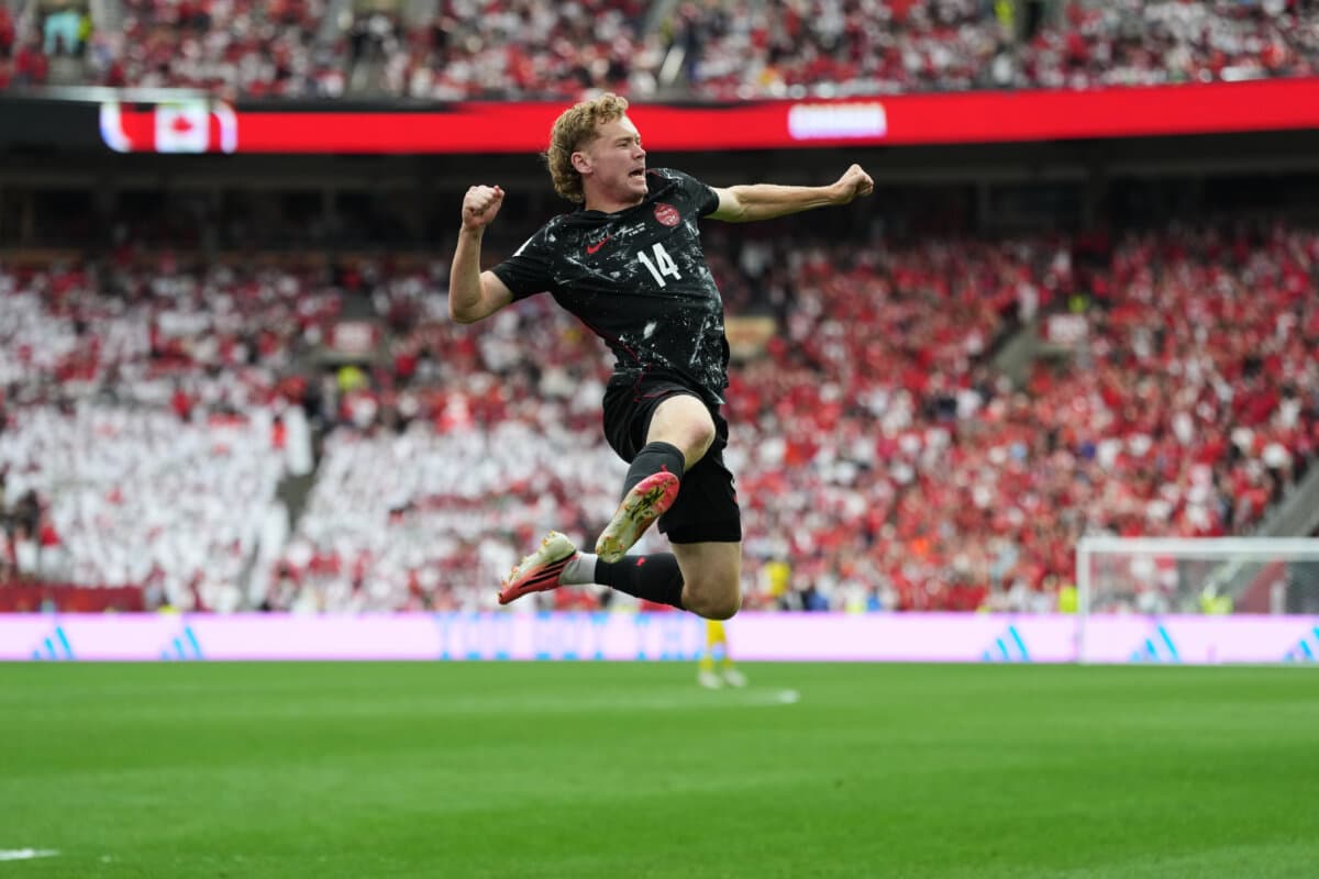 Canada's Jacob Shaffelburg celebrates after Qatar's Mohamed Manai scores an own goal during the World Cup Group B soccer match in Vancouver, British Columbia, on June 18, 2026. (Abbie Parr/AP Photo)