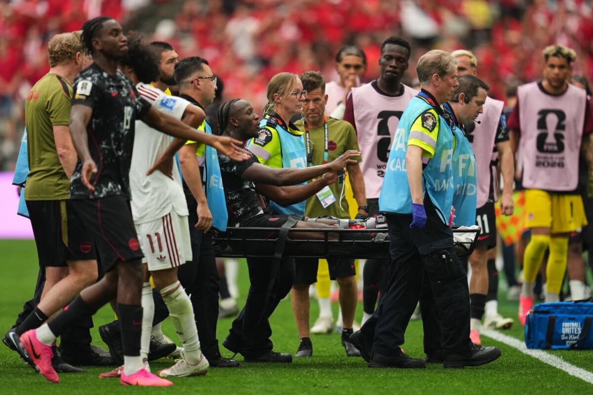 Canada's Ismaël Koné  is carried off of the field after receiving medical attention during the World Cup Group B soccer match against Qatar in Vancouver on June 18, 2026. (AP Photo/Abbie Parr)