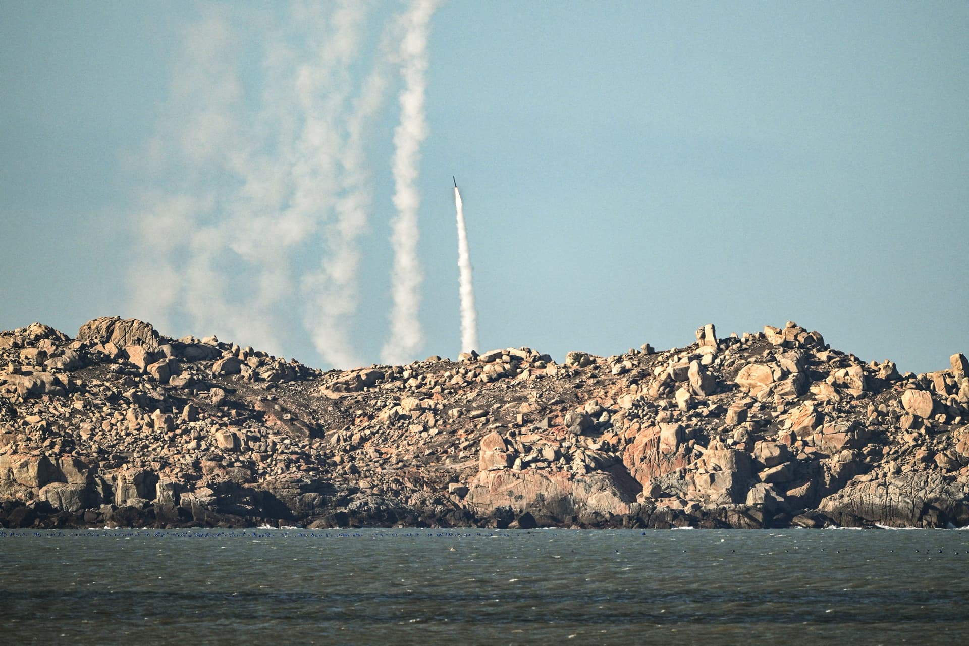 The Chinese military fires a rocket into the air during military drills on Pingtan Island, which sits across the Taiwan Strait from Taiwan, in eastern Fujian Province, China, on Dec. 30, 2025. (Adek Berry/AFP via Getty Images)