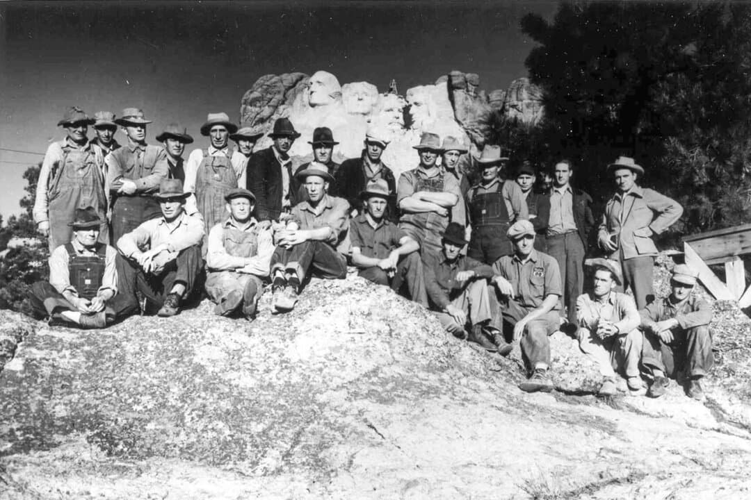 The last work crew to work on Mount Rushmore poses in front of the monument in 1941. Almost 400 workers labored at the memorial over the 14 years it took to carve, from 1927 to 1941. (Courtesy of S.D. Historical Society)