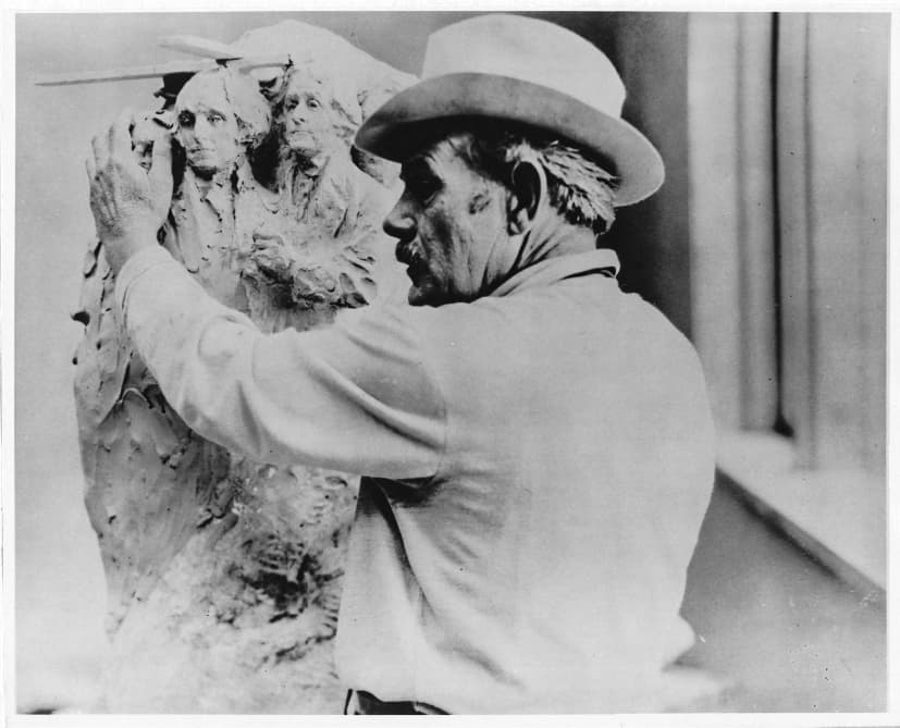 Sculptor Gutzon Borglum stands next to a clay model of Mount Rushmore, near Keystone, S.D., in this file photo. Borglum viewed the monument as an everlasting symbol of the American Dream that he cherished. (Courtesy of South Dakota Historical Society)