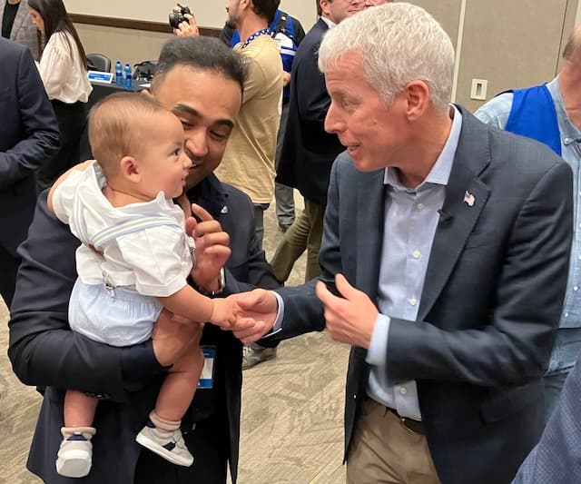 Aalo Atomics President and Co-founder Yasir Arafat introduces United States Energy Secretary Chris Wright (R) to his 7-month-old son, Sufyan, on June 25, 2026, shortly after Wright signed the authorization for Aalo’s micro-reactor to achieve criticality next week at Idaho National Laboratory near Idaho Falls, Idaho. (John Haughey/The Epoch Times)