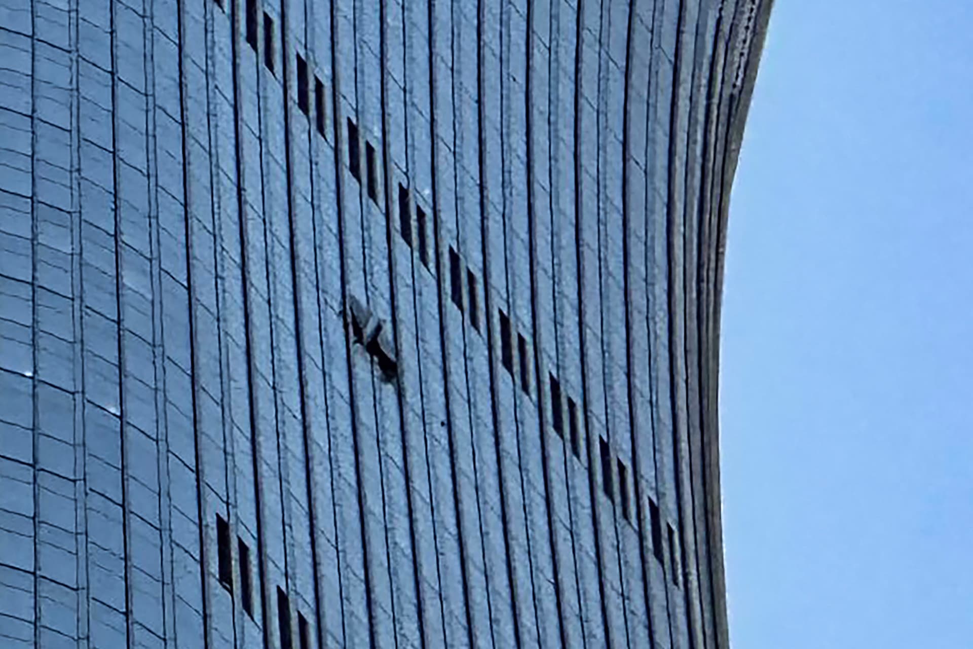 A hole is seen on the side of the CITIC Tower in Beijing on June 26, 2026, after an eyewitness reported plane debris at the base of Beijing's tallest building. (Peter Catterall/AFP via Getty Images)