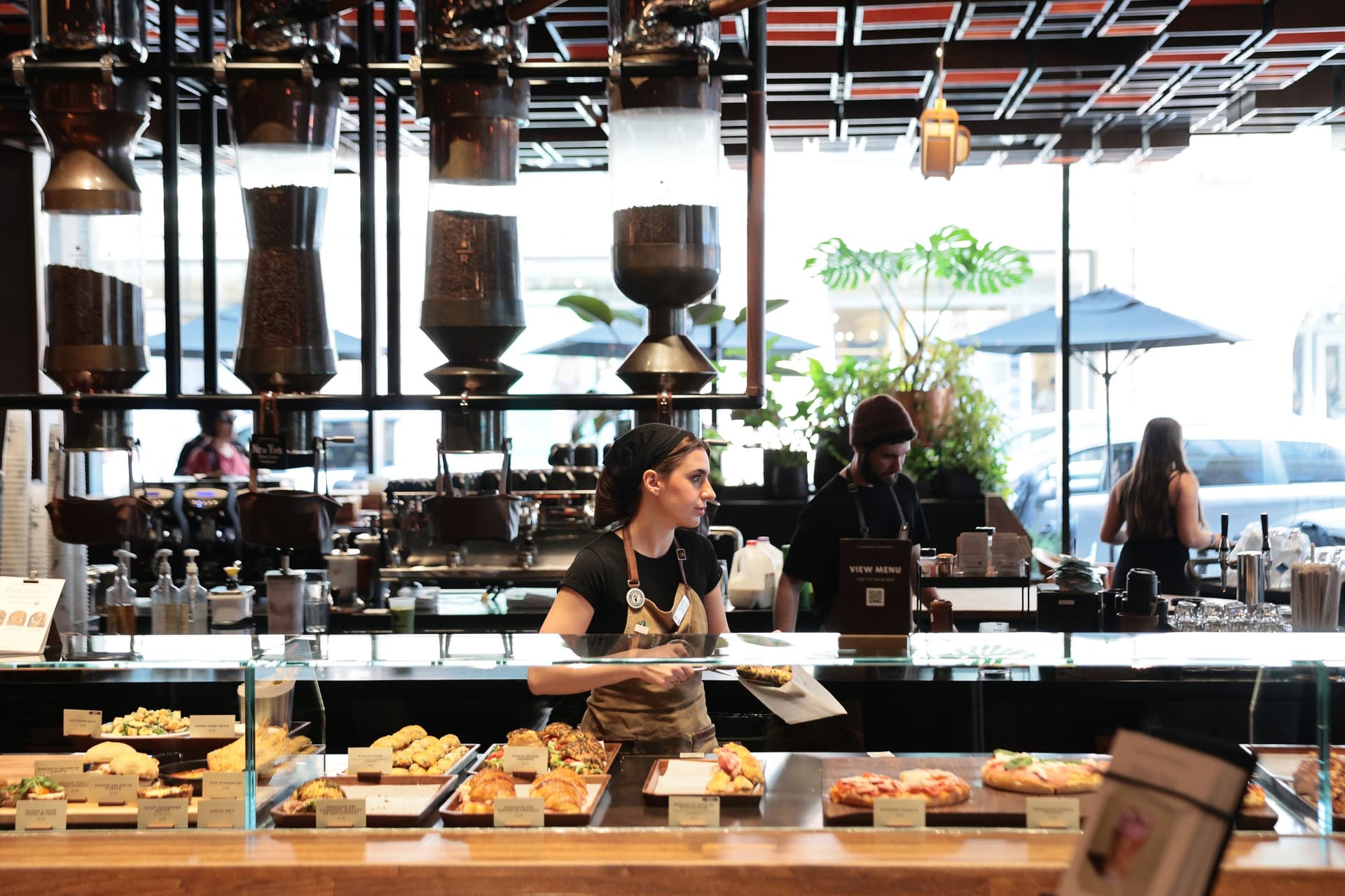 A Starbucks employee grabs a pastry in New York City on March 31, 2026. (Michael M. Santiago/Getty Images)