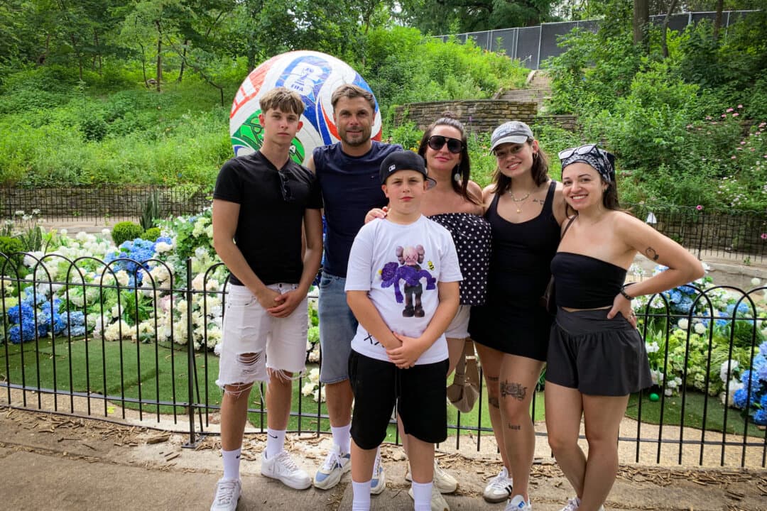 The Ozga family from Zabrze, Poland, enjoy a World Cup celebration with family members from New Jersey at the FIFA Fan Festival in Philadelphia on June 30, 2026. David Ozga is a professional coach and former player for Polish soccer team Gornik Zabrze. (Aaron Gifford/The Epoch Times)  