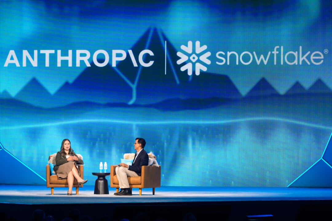 Anthropic co-founder and president Daniela Amodei (L) speaks with the CEO of AI platform Snowflake, Sridhar Ramaswamy, during the keynote presentaton at Snowflake Summit 26 in San Francisco on June 1, 2026. The Pentagon has designated Anthropic, which partners with Snowflake, a supply chain risk. (Jeff Chiu/AP)