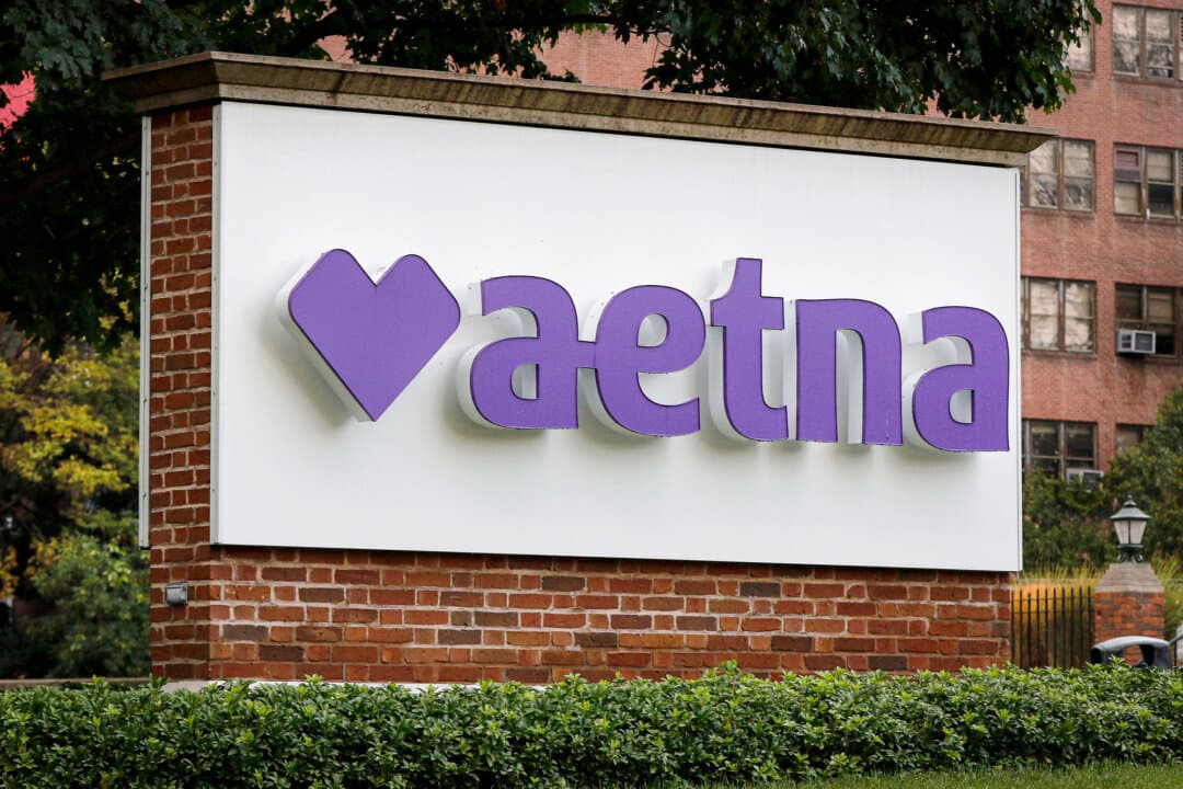 A sign at the campus of insurance and managed health care company Aetna in Hartford, Conn., on Aug. 28, 2020. The Department of Justice alleges that Aetna used medical chart reviews to identify instances where it could seek additional payments from the Centers for Medicare and Medicaid Services, while ignoring those same results when they indicated Aetna was overpaid. (Bill Sikes/AP Photo/File)
