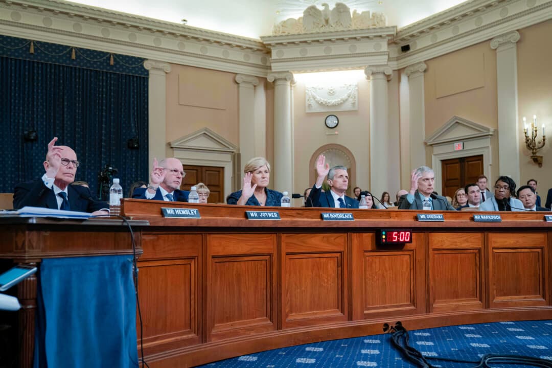 (L–R) UnitedHealth Group CEO Stephen Hemsley, CVS Health Group President and CEO David Joyner, Elevance President and CEO Health Gail Boudreaux, Cigna Health Group President, CEO, and chairman of the Board, David Cordani, Ascendiun President and CEO Paul Markovich, and Bank of Jabez co-founder ReShonda Young testify before a House Committee on Ways and Means hearing on Capitol Hill in Washington, on Jan. 22, 2026. Young, a breast cancer survivor, testified about soaring health insurance premiums, which are linked to risk assessment and billing fraud. (Jose Luis Magana / AP Photo)