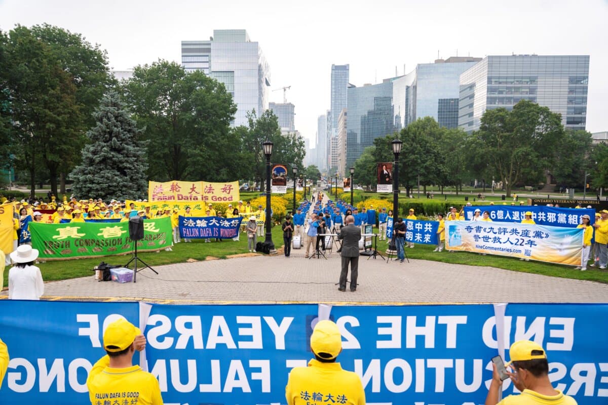 Falun Gong practitioners hold a rally to mark 27 years of the CCP's persecution of Falun Gong, at Queen's Park in Toronto on July 18, 2026. (Evan Ning/The Epoch Times)