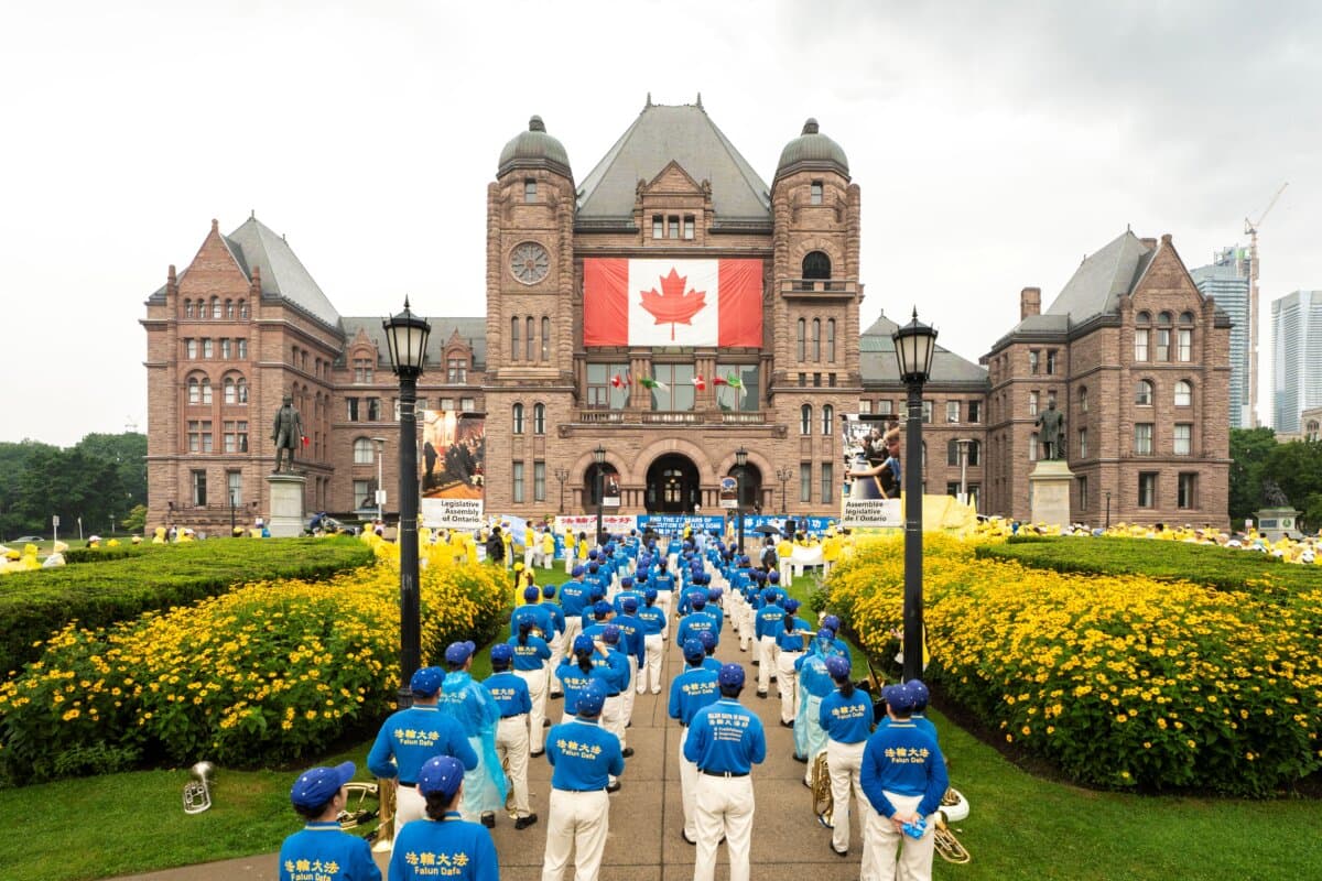 Falun Gong practitioners hold a rally to mark 27 years of CCP's persecution of Falun Gong, at Queen's Park, Toronto, on July 18, 2026. (Evan Ning/The Epoch Times)