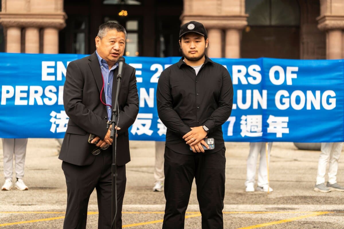 Houqiang Yu (L), president of the China Democratic Party of Canada, speaks at a rally to mark 27 years of CCP's persecution of Falun Gong, at Queen's Park, Toronto, on July 18, 2026. (Evan Ning/The Epoch Times)