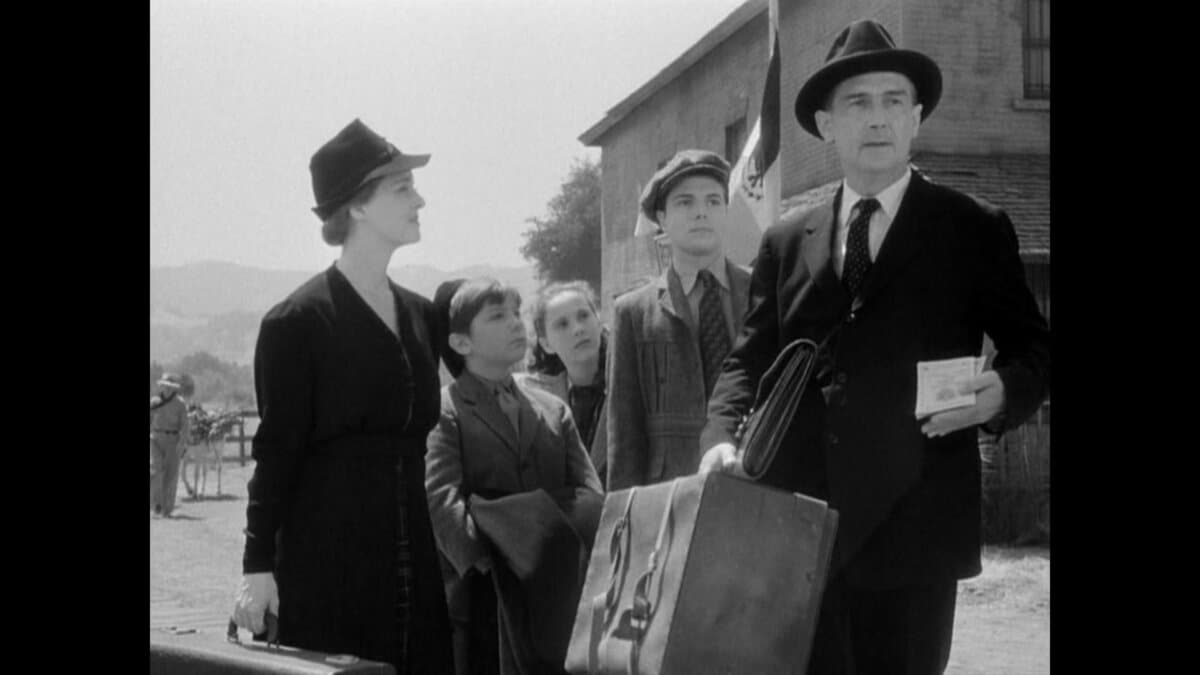 The Muller family flees Nazi Germany: (L–R) Sara (Bette Davis), Bodo (Eric Roberts), Babette (Janis Wilson), Joshua (Donald Buka), and Kurt (Paul Lukas), in “Watch on the Rhine.” (Warner Bros. Pictures)