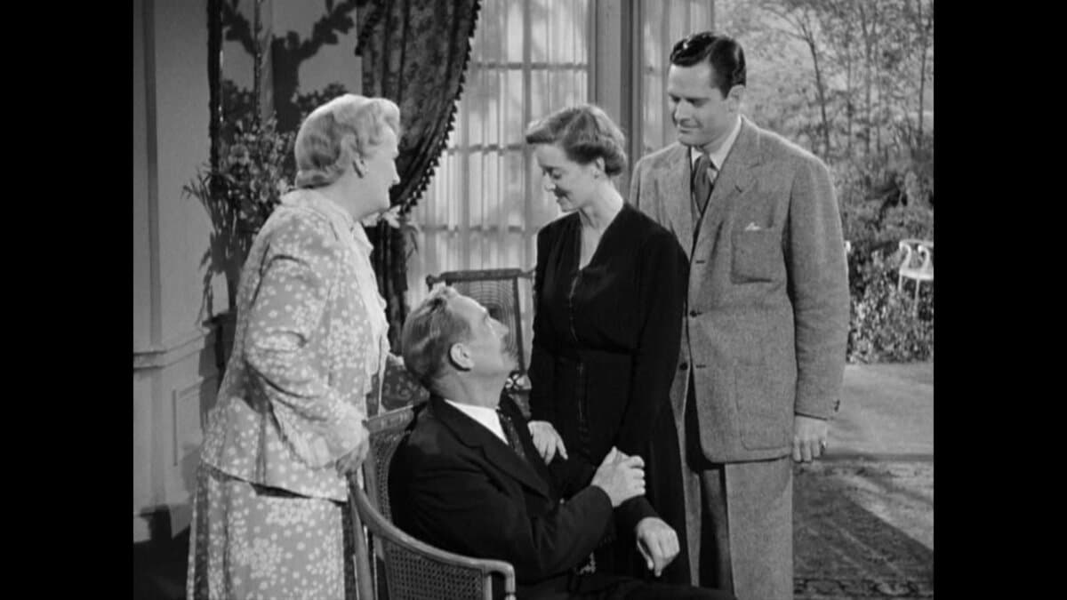 (L–R) Mrs. Fanny Farrelly (Lucile Watson), Kurt Muller (Paul Lukas), Sara Muller (Bette Davis), and David Farrelly (Donald Woods), in “Watch on the Rhine.” (Warner Bros. Pictures)