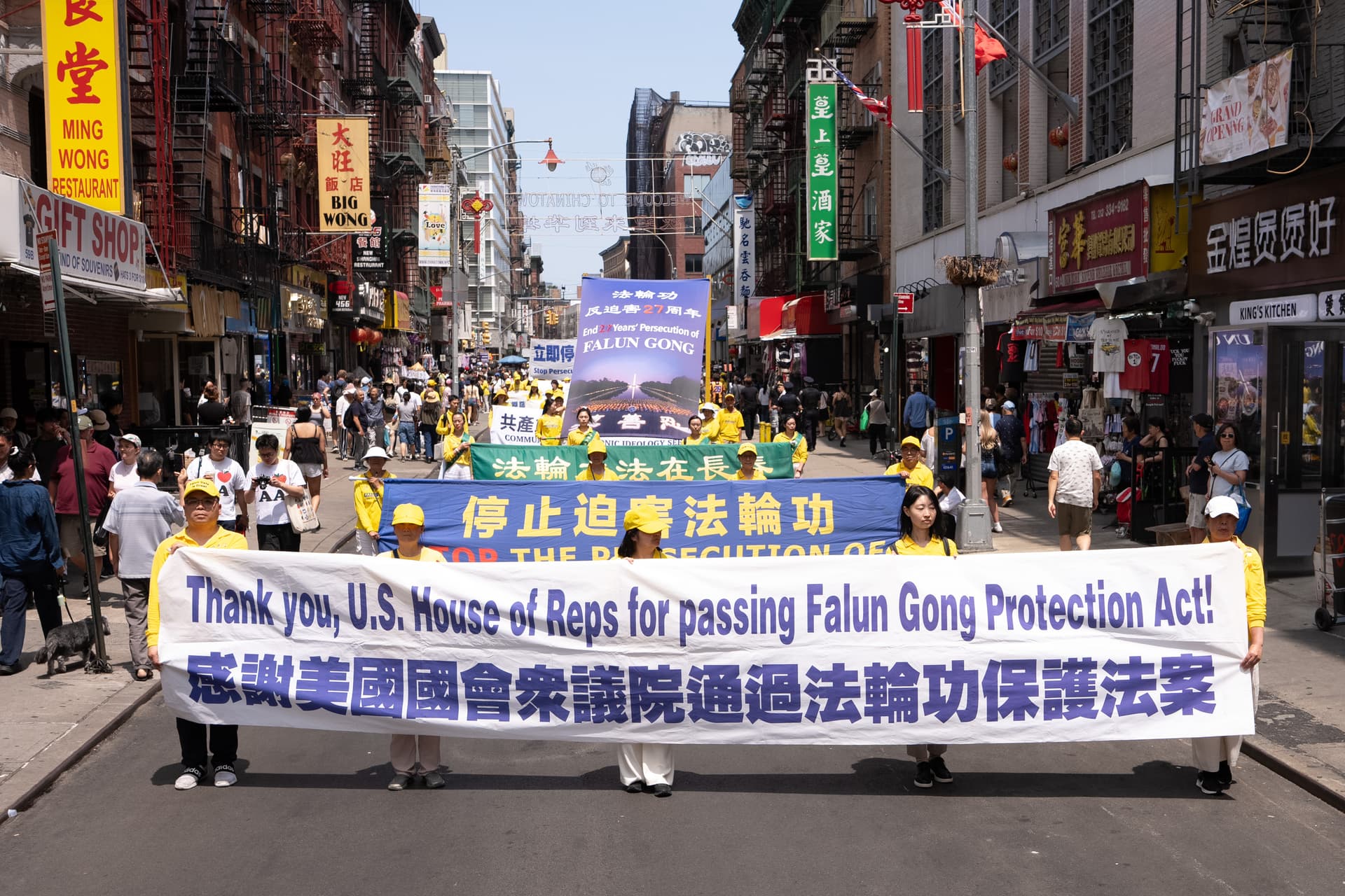 Falun Gong practitioners march during a parade calling for the end of the Chinese Communist Party’s 27 years of ongoing persecution against the spiritual practice, in New York City on July 19, 2026. (Larry Dye/The Epoch Times)