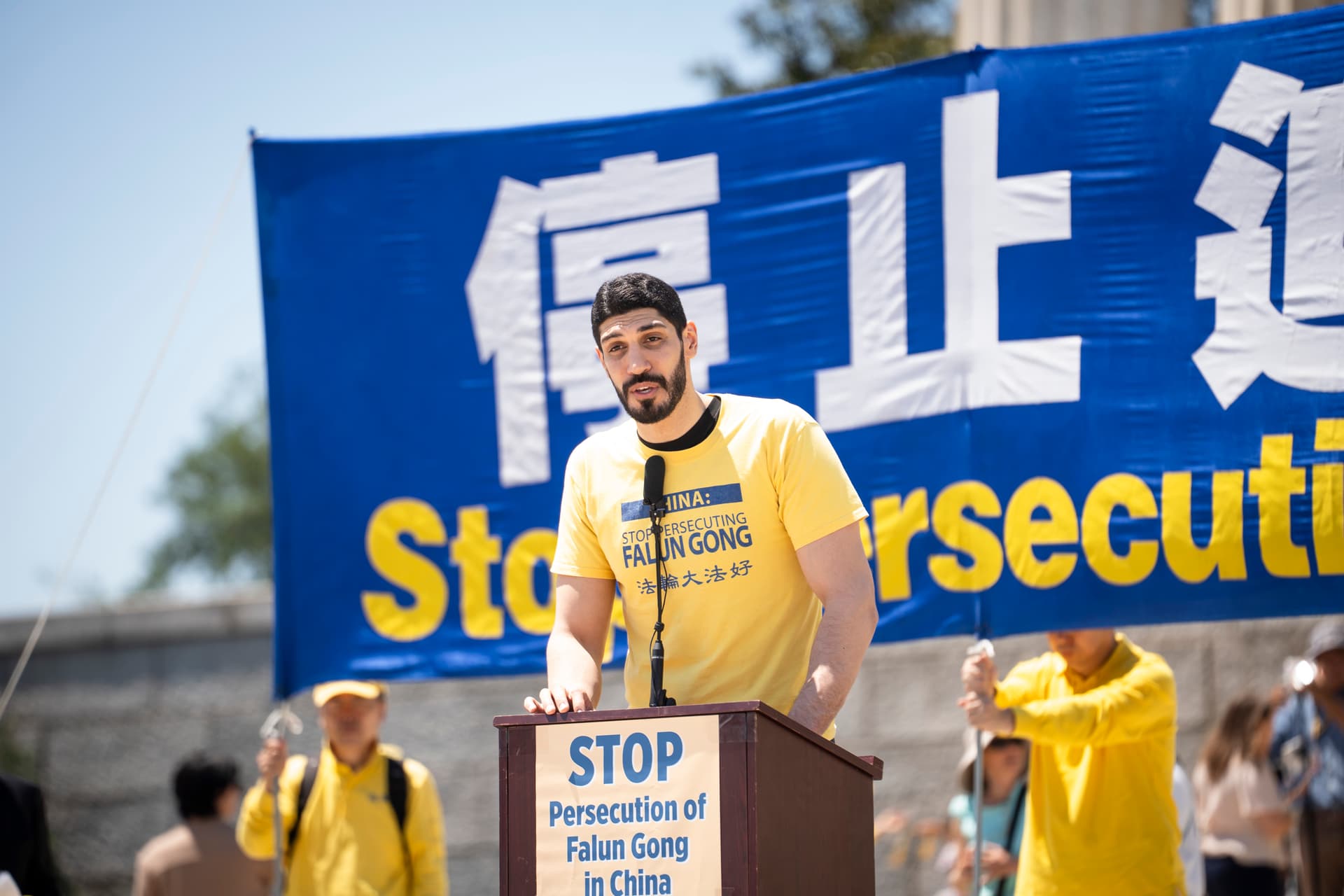 Enes Kanter Freedom, human rights advocate and former NBA player, speaks during an annual rally calling for the end of the Chinese Communist Party’s ongoing persecution of Falun Gong in China, at the Lincoln Memorial in Washington on July 23, 2026. (Madalina Kilroy/The Epoch Times)