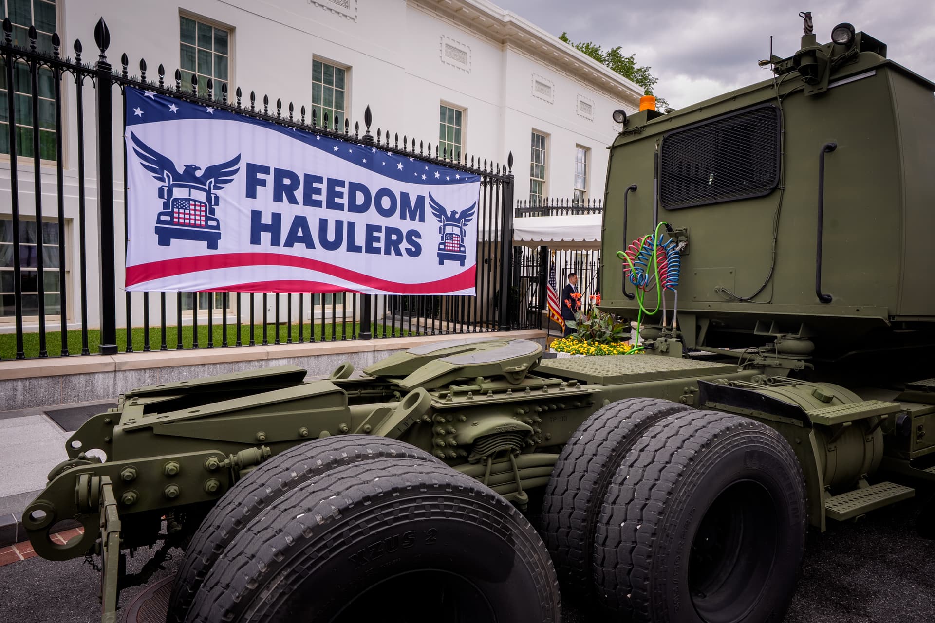 A military truck is parked at the announcement event of the Freedom Haulers initiative on West Executive Avenue between the West Wing of the White House and the Eisenhower Executive Office Building in Washington on July 30, 2026. (Andrew Harnik/Getty Images)
