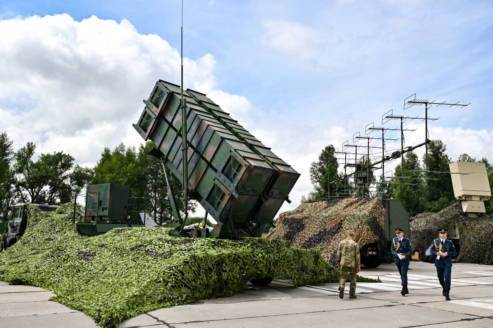 Ukrainian servicemen walk past a Patriot air defence system at an undisclosed area in Ukraine on Aug. 4, 2024. (Sergei Supinsky/AFP via Getty Images)