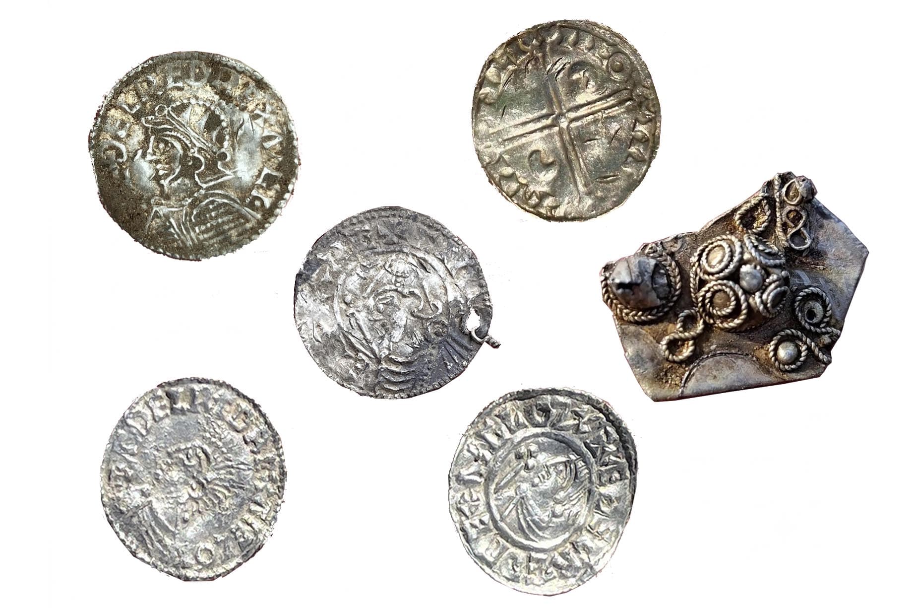 Foreign and domestic silver coins and bullion were found in the Mørstad Hoard, the largest Viking Age hoard recorded in Norwegian history. (Innlandet County Authority)
