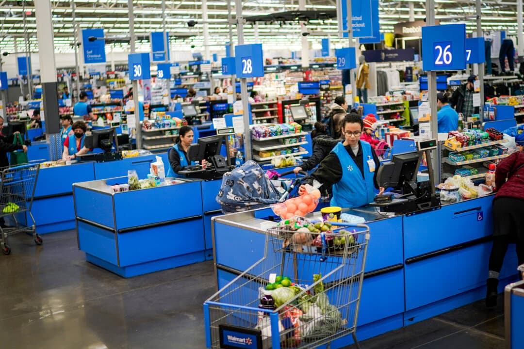 Cashiers process purchases at a Walmart Supercenter in North Bergen, N.J., on Feb. 9, 2023. (Eduardo Munoz Alvarez, File/AP Photo)