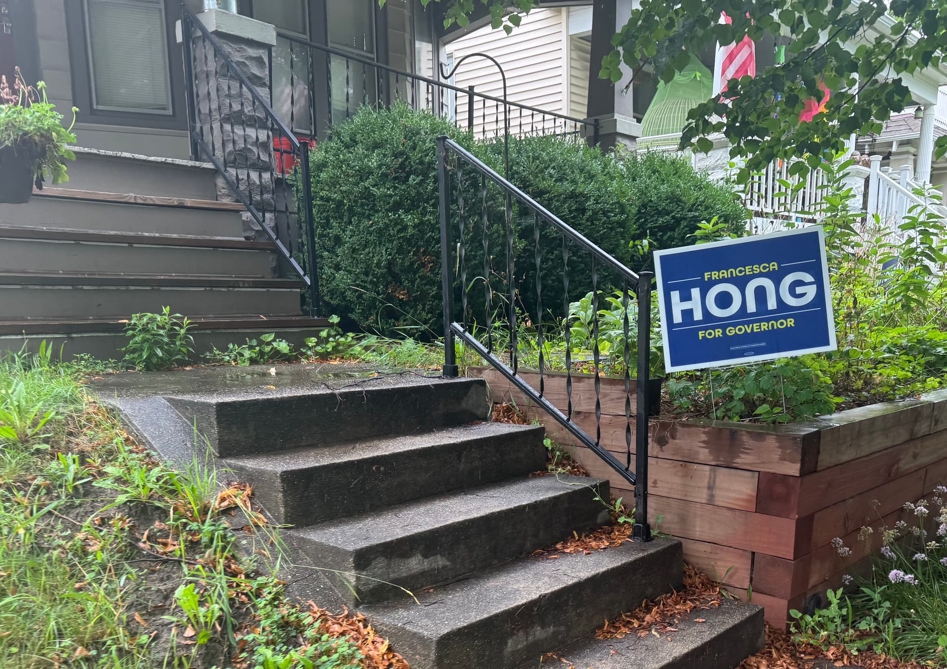 One of many yard signs displaying support for gubernatorial candidate Francesca Hong in the Milwaukee suburbs on August 11, 2026. (Joseph Lord/The Epoch Times)