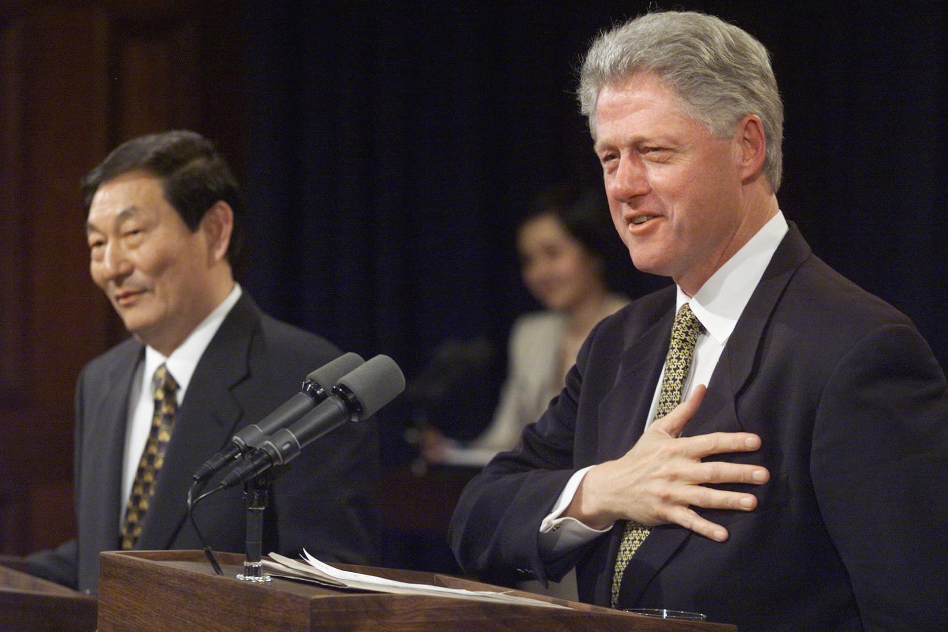 U.S. President Bill Clinton (R) responds to a question as Chinese Premier Zhu Rongji looks on during a joint news conference in the Old Executive Office Building in Washington on April 8, 1999. (Tim Sloan/AFP via Getty Images)
