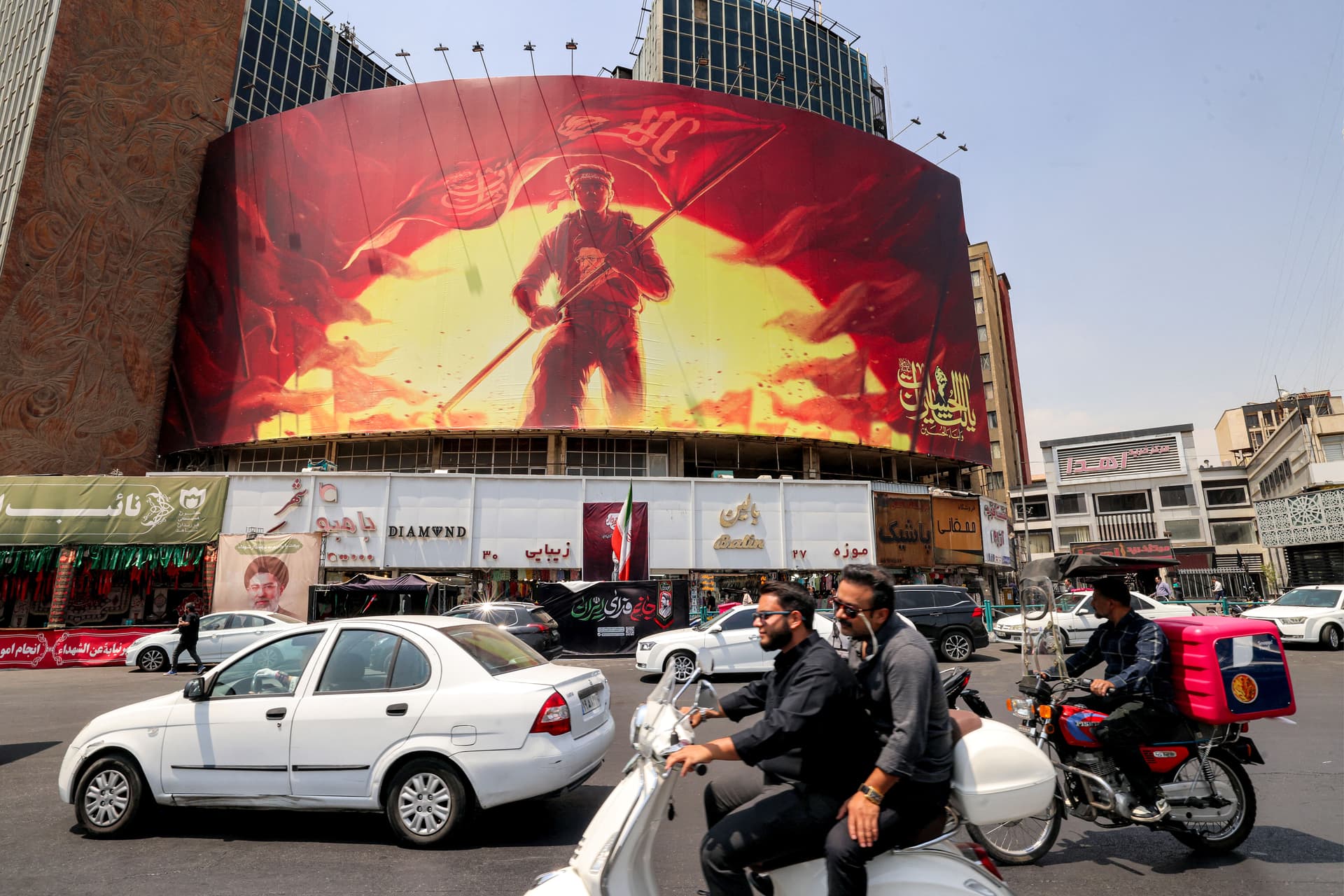 Traffic in front of a political billboard at Valiasr Square in central Tehran, Iran, on Aug. 8, 2026. (Atta Kenare/AFP via Getty Images)