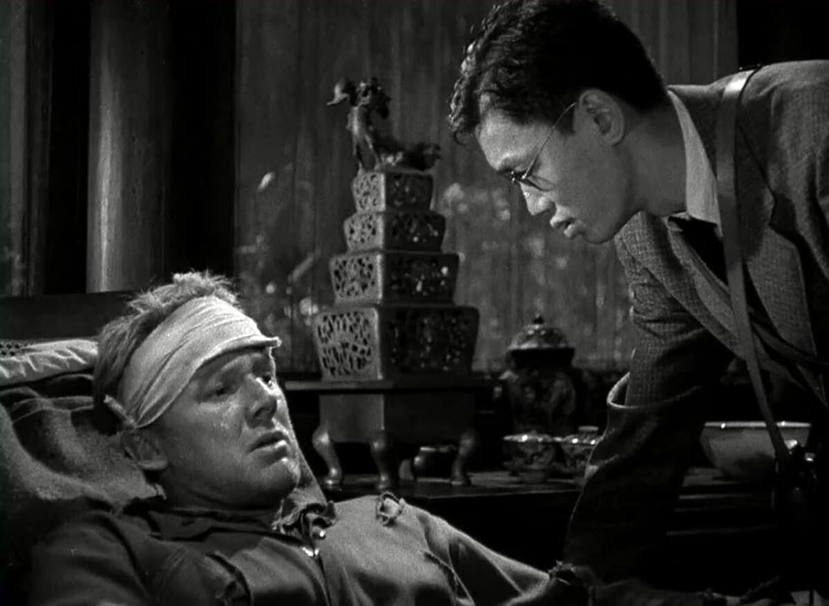 Ted Lawson (Van Johnson) and a patrol boat captain (Harold Fong), in “Thirty Seconds Over Tokyo.” (MGM)