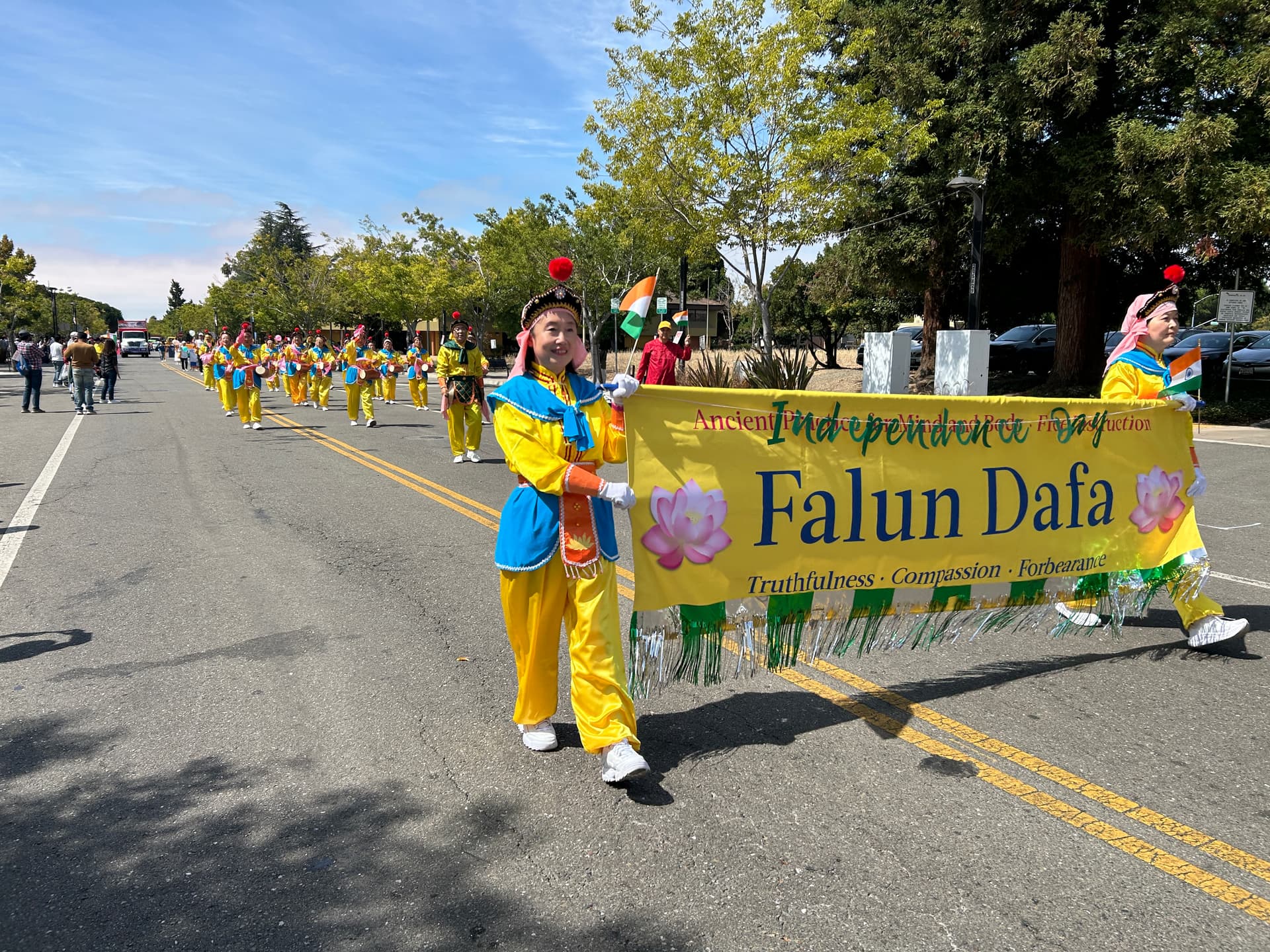 A parade contingent of Falun Dafa practitioners from Northern California participates in the India Independence Day celebration parade in Fremont, Calif., on Aug. 16, 2026. (Nathan Su/The Epoch Times)