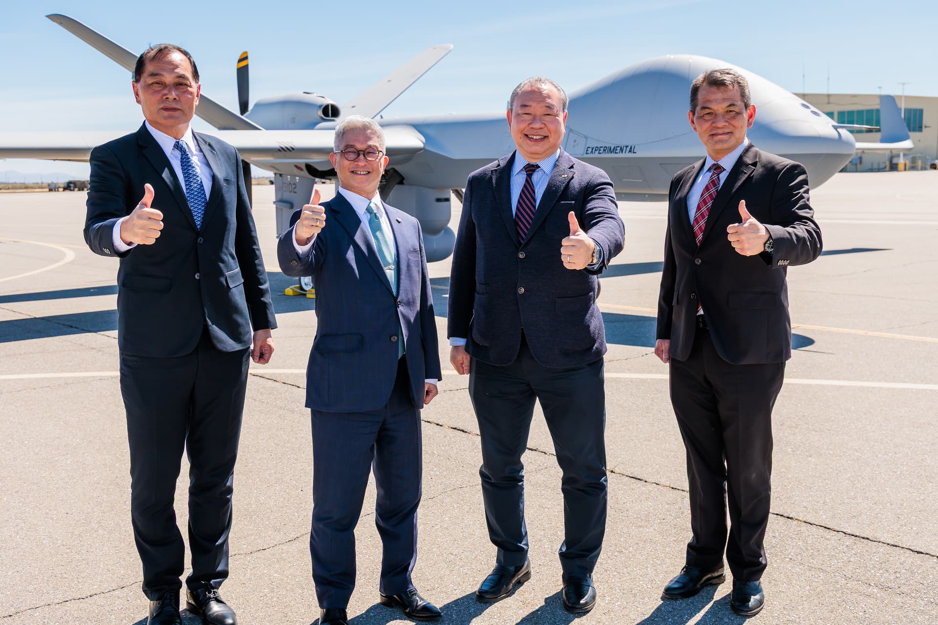 Taiwanese defense officials pose with an MQ-9B unmanned aircraft during a delivery ceremony in the United States on March 17, 2026. Taiwan has purchased four MQ-9Bs, with two scheduled for delivery in 2026 and two in 2027. (Courtesy of Taiwan Ministry of National Defense)