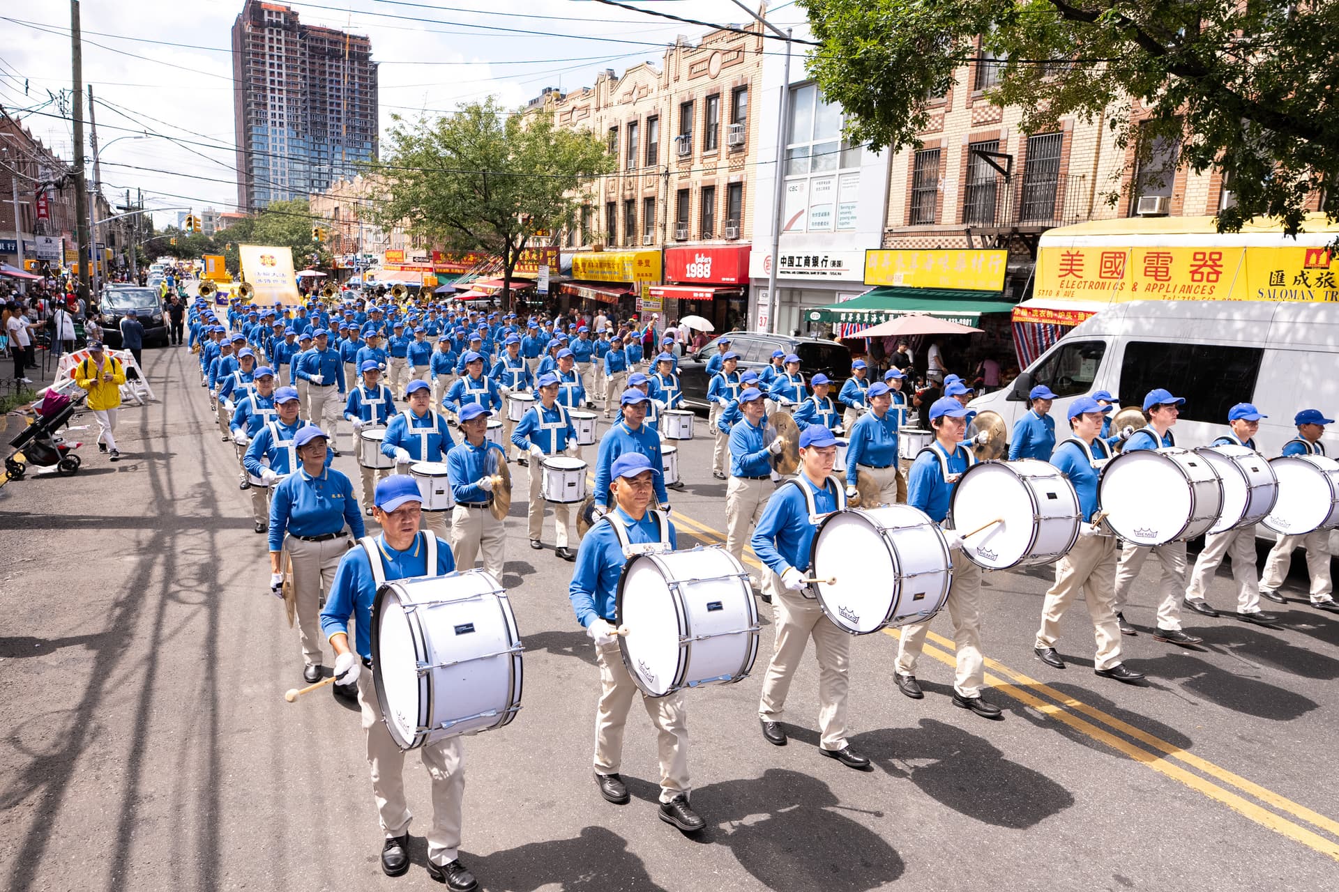 Falun Dafa practitioners take part in a march in New York City on Aug. 23, 2026. (Larry Dye/The Epoch Times)