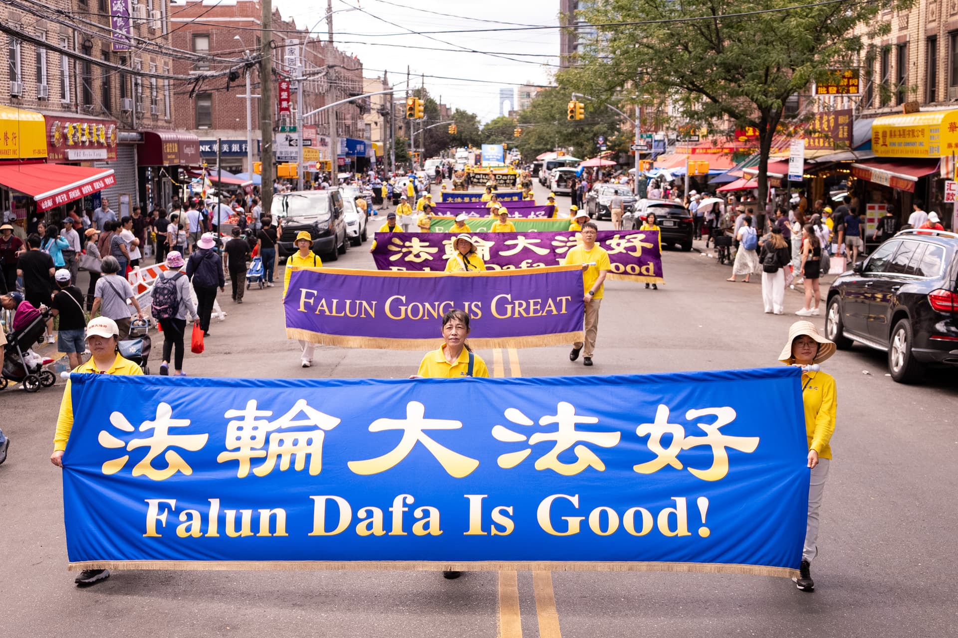 Falun Dafa practitioners take part in a march in New York City on Aug. 23, 2026. (Larry Dye/The Epoch Times)