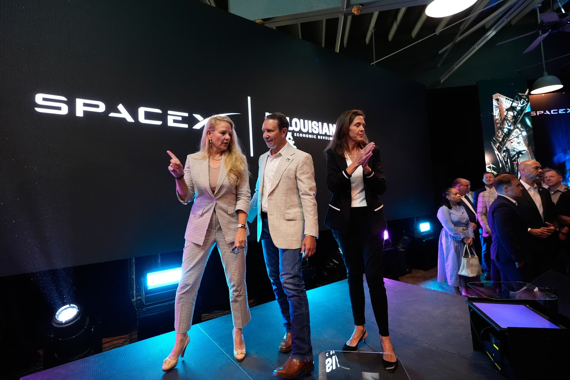 SpaceX President and COO Gwynne Shotwell (L) speaks with Louisiana Gov. Jeff Landry (C) and Secretary of Louisiana Economic Development Susan Bonnett Bourgeois during an event with SpaceX announcing a deal to build a spaceport in Louisiana, in Abbeville, La., on Aug. 25, 2026. (Gerald Herbert/AP Photo)