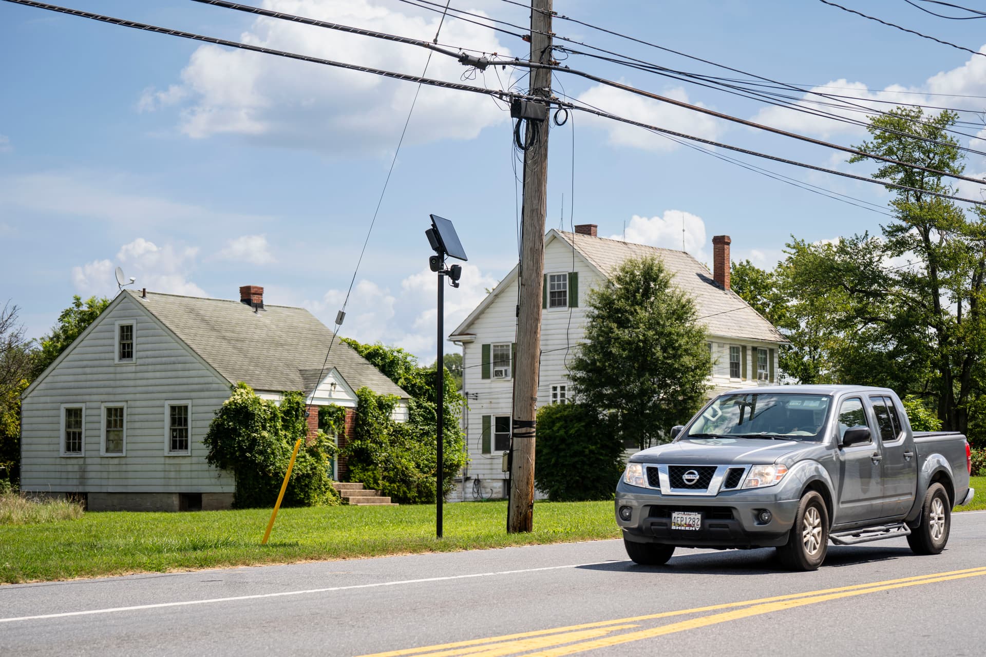 Two Flock safety cameras in a neighborhood in Jessup, Md., on Aug. 26, 2026. (Madalina Kilroy/The Epoch Times)