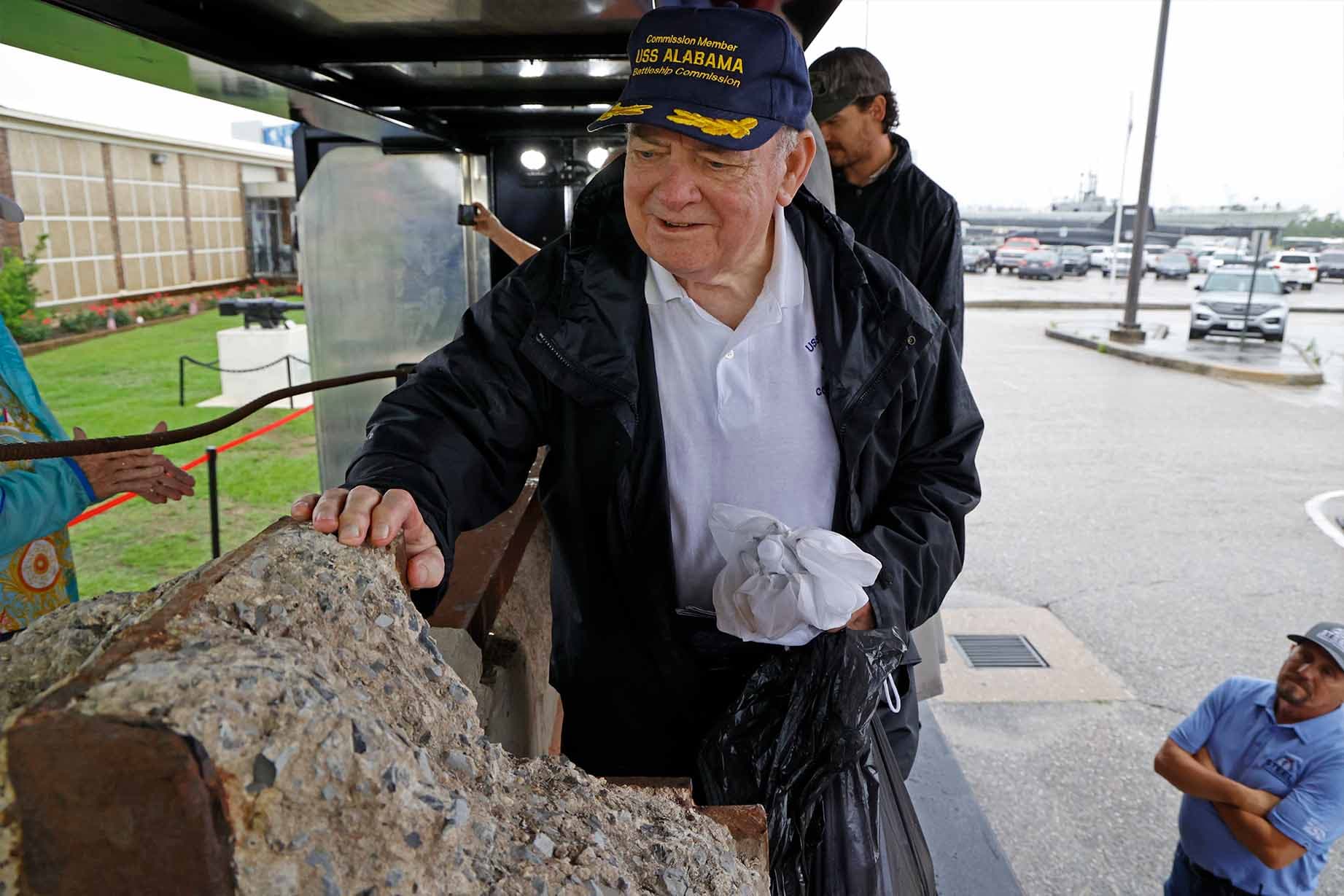 A man rests his hand on the steel girder near the USS Alabama on Memorial Day. (Tunnel to Towers)