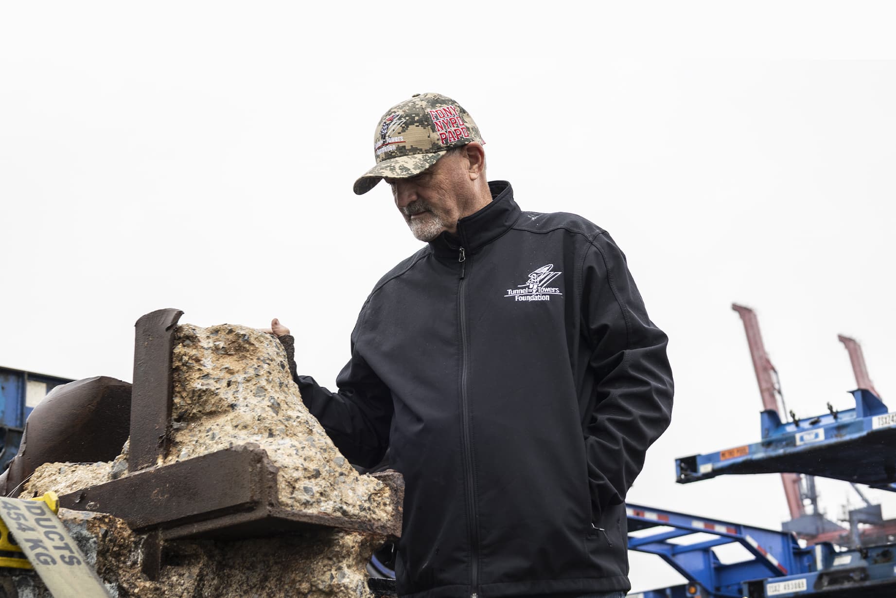Frank Siller examines the steel I-beam at a port in New York. (Tunnel to Towers)