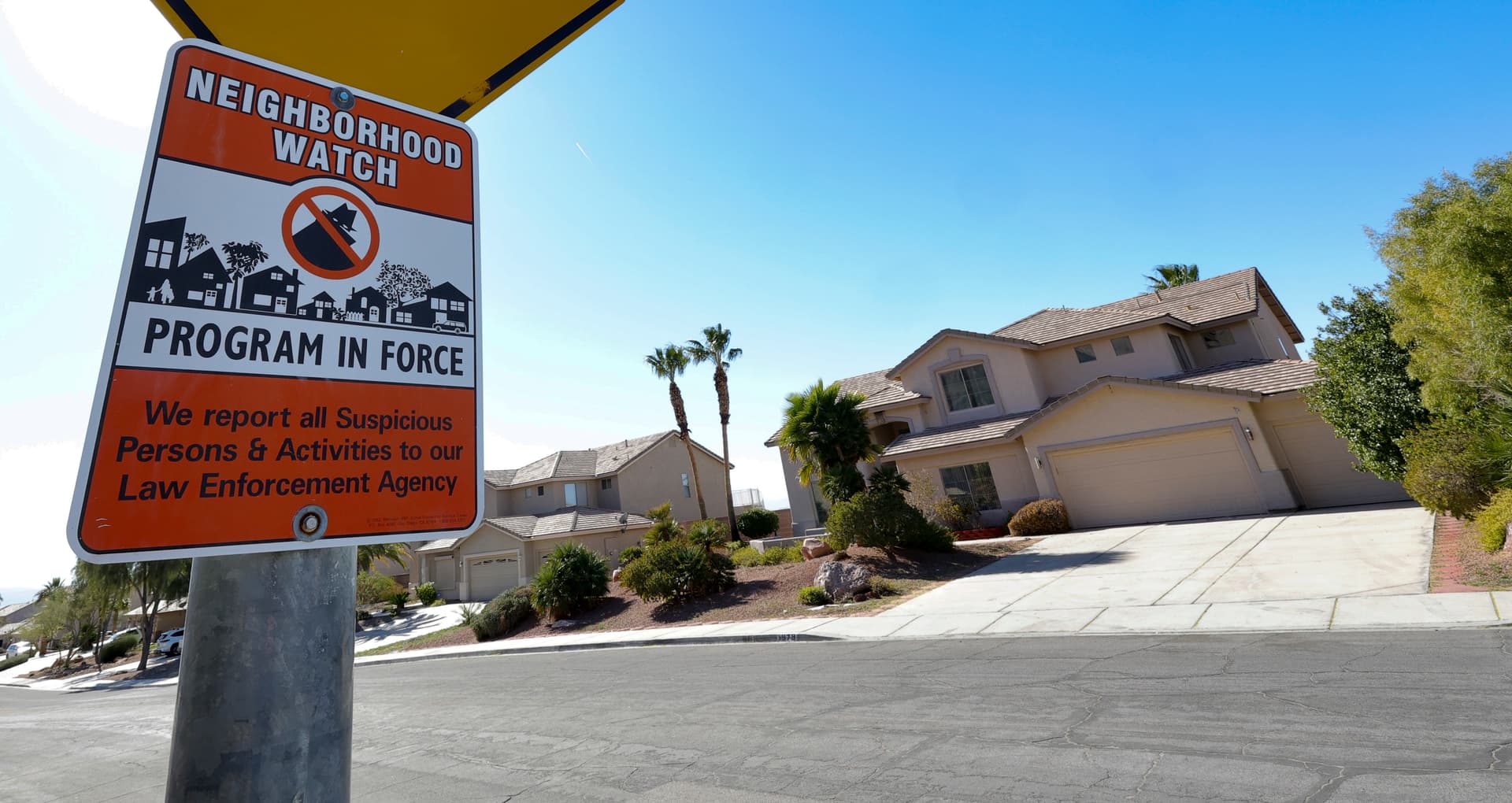 A Neighborhood Watch sign is posted across the street from a home that the FBI and the Las Vegas Metropolitan Police Department are investigating for having an alleged illegal lab in the garage in Las Vegas on Feb. 3, 2026. (Ethan Miller/Getty Images)