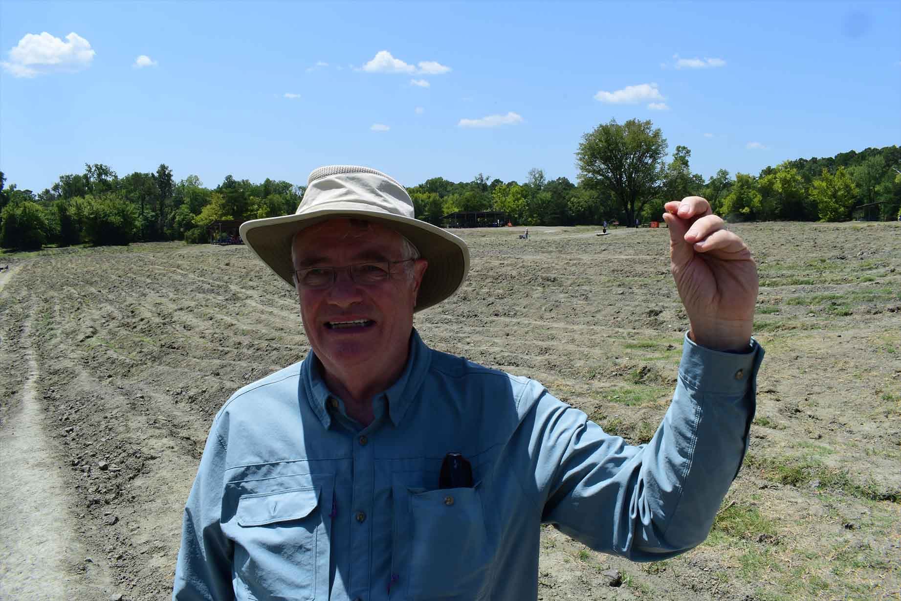 Barry Smith, from Germantown, Tennessee, holds up his 2.29-carat yellow diamond, which he christened the Sage Juniper Diamond after his granddaughters. (Crater of Diamonds State Park)