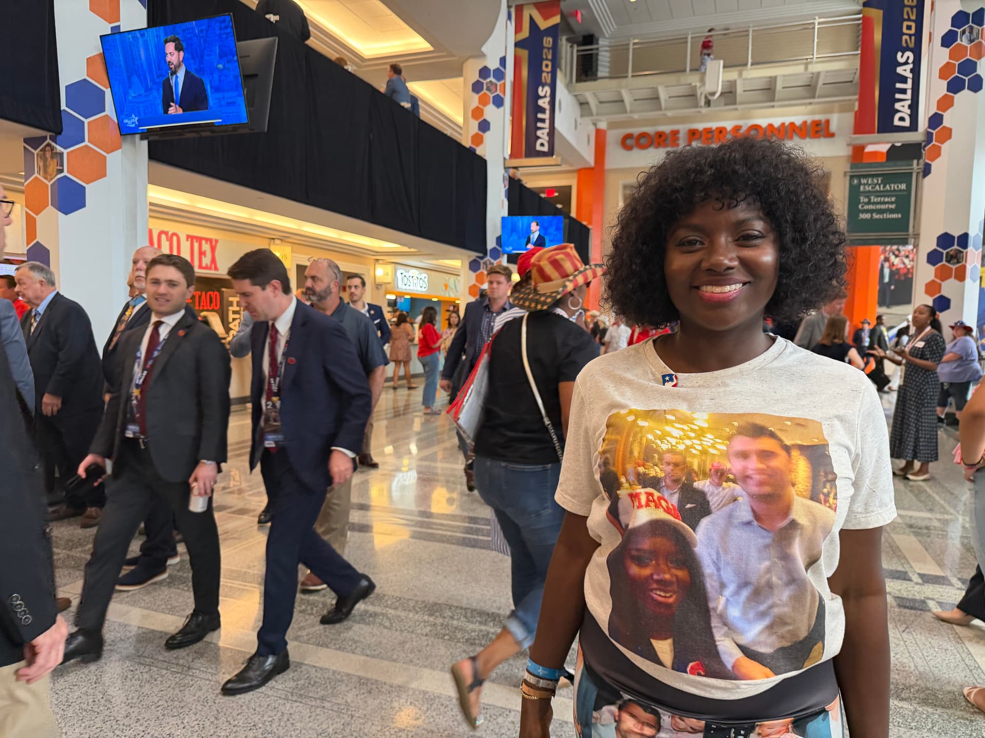 Ajua Mason, 43, of Dallas, shows off a T-shirt picturing her with conservative activist Charlie Kirk as she and other fans of Kirk mark the one-year anniversary of his death with tributes at the GOP convention at the American Airlines Center in Dallas on Sept. 10, 2026. (Janice Hisle/The Epoch Times)