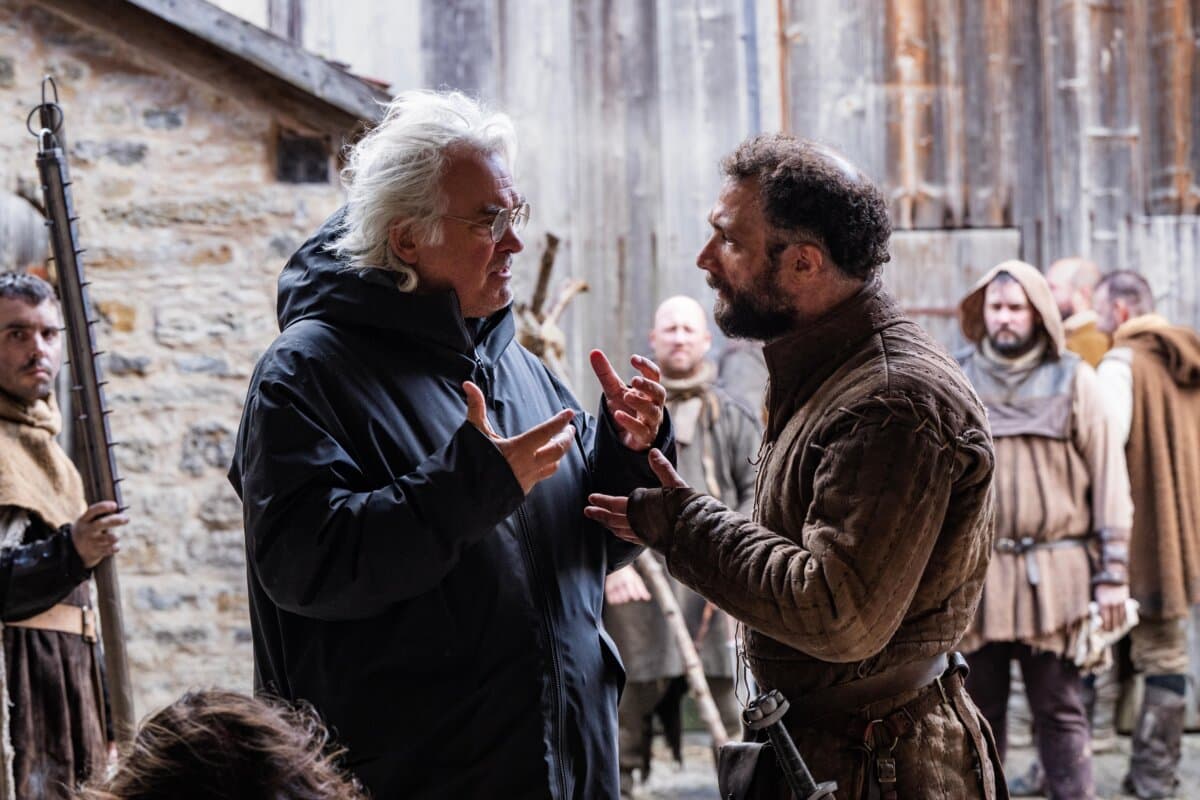 Director Paul Greengrass (L) and Cosmo Jarvis on the set of “The Uprising.” (Betina la Plante/Focus Features)