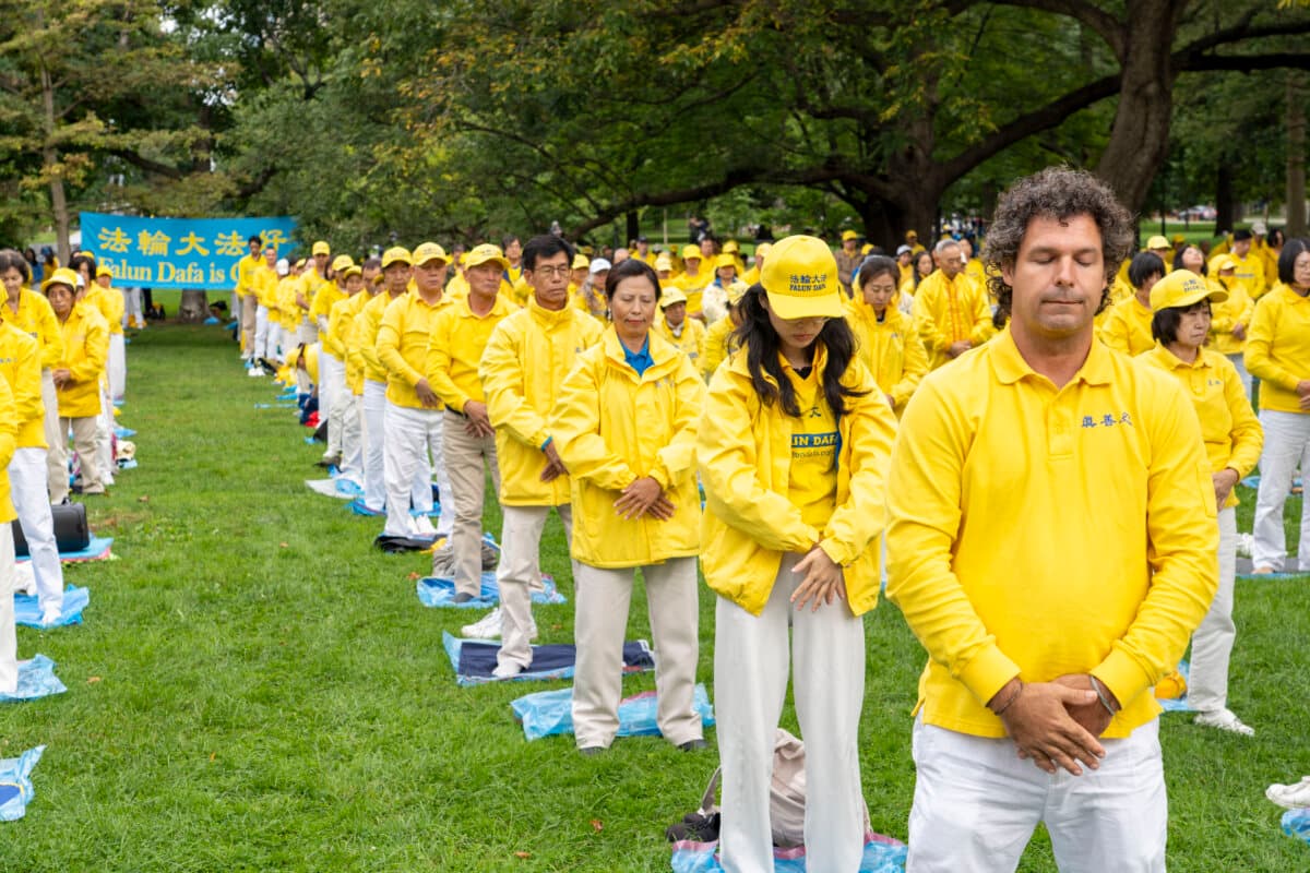 Falun Gong practitioners perform the spiritual discipline's meditative exercises at an event at Queen's Park, to call for an end to the Chinese regime's persecution and transnational repression, in Toronto on Sept. 19, 2026. (Evan Ning/The Epoch Times)