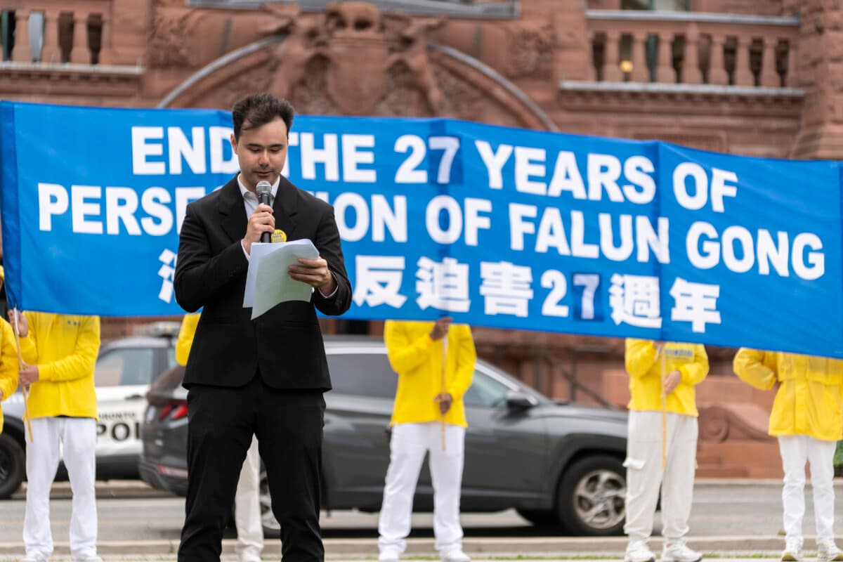 Falun Gong practitioner and event host Matthew Leeder speaks at a rally at Queen's Park to call for an end to the Chinese regime's persecution and transnational repression, in Toronto on Sept. 19, 2026. (Evan Ning/The Epoch Times)